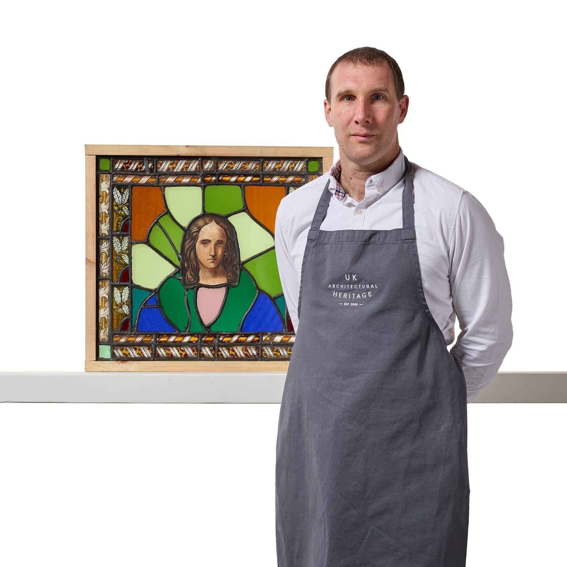An abstract reclaimed ecclesiastical stained glass panel dating to the mid 19th century.

The vibrant colours and patterns are emphasised by the eye catching depiction of Jesus bordered by a foliate frame in a modernist style.

With elements dating