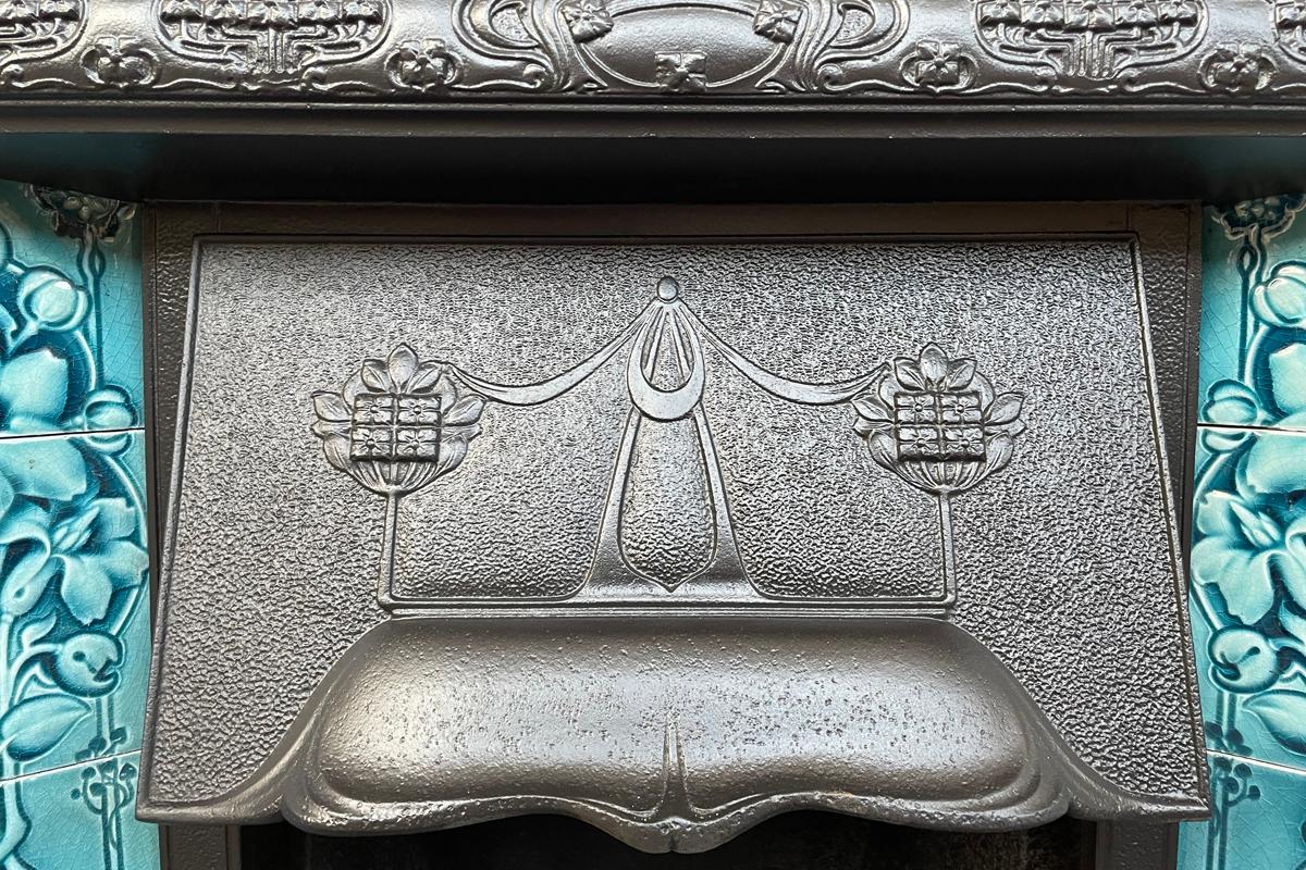 Cast Reclaimed Edwardian Art Nouveau cast iron and tiled fireplace grate