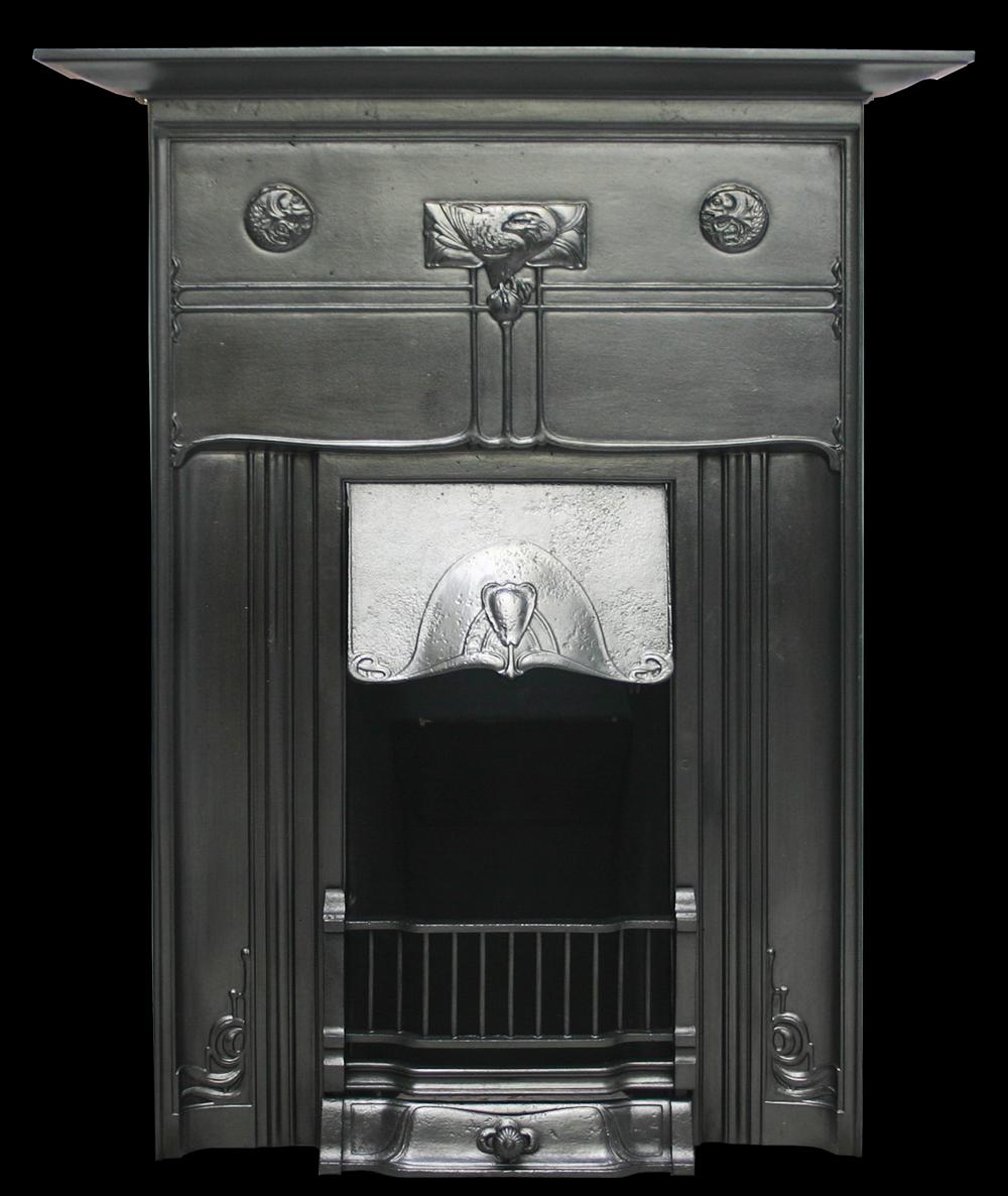 Reclaimed Edwardian Art Nouveau cast iron combination fireplace. The unusual design on the frieze shows an eagle perched on a sphere flanked by two discs depicting coiled fish.

Finished with traditional black grate polish.