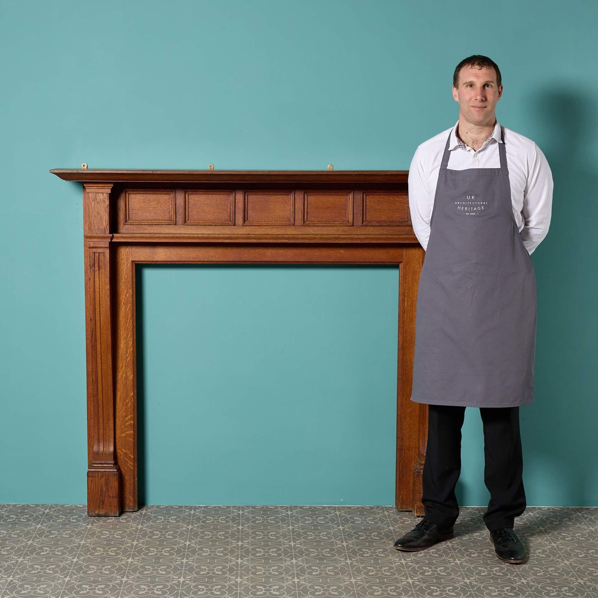 A simple and handsome early 20th century reclaimed Edwardian oak fire mantel. This beautiful solid oak fire surround has an understated design with a smart panelled frieze that will fit in seamlessly with the styling of modern and traditional