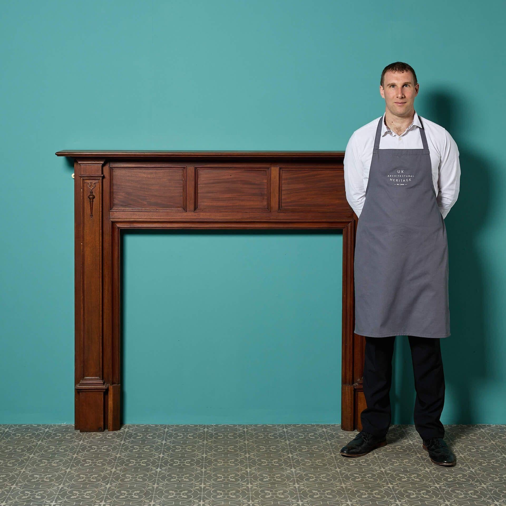 A reclaimed Edwardian style mahogany fire surround. This fireplace will fit in seamlessly with the styling of modern and traditional properties alike. It has an original finish, the rich walnut colour complimenting its beauty.

The panelled frieze