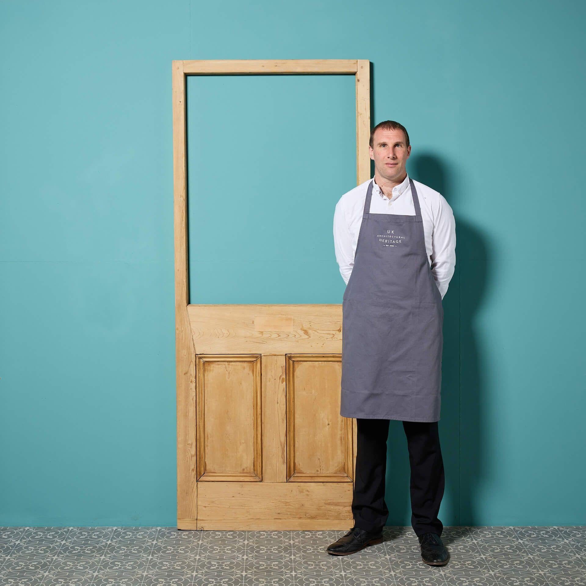 This unglazed pine door circa 1890 makes a beautiful, reclaimed Edwardian style or Victorian front door for a period townhouse. It features a large unglazed panel to the top, allowing for custom glazing in clear, textured or stained glass to suit