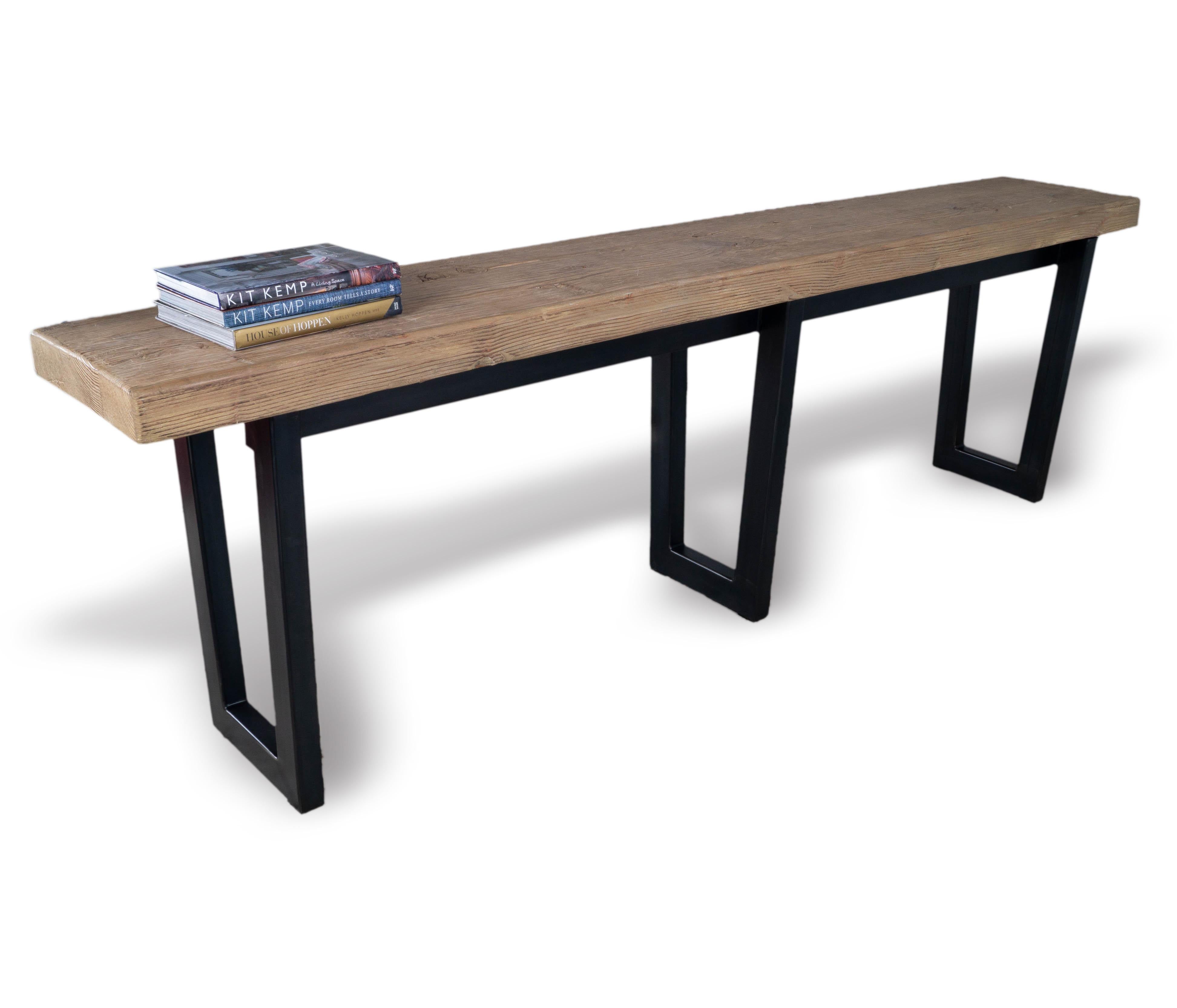 Make a statement with this beautiful Reclaimed Elm Console Table. Crafted from organic reclaimed elm wood on top of an ebonized steel base, its mid-century, industrial inspired style is perfect for any modern home or office. Be the envy of your