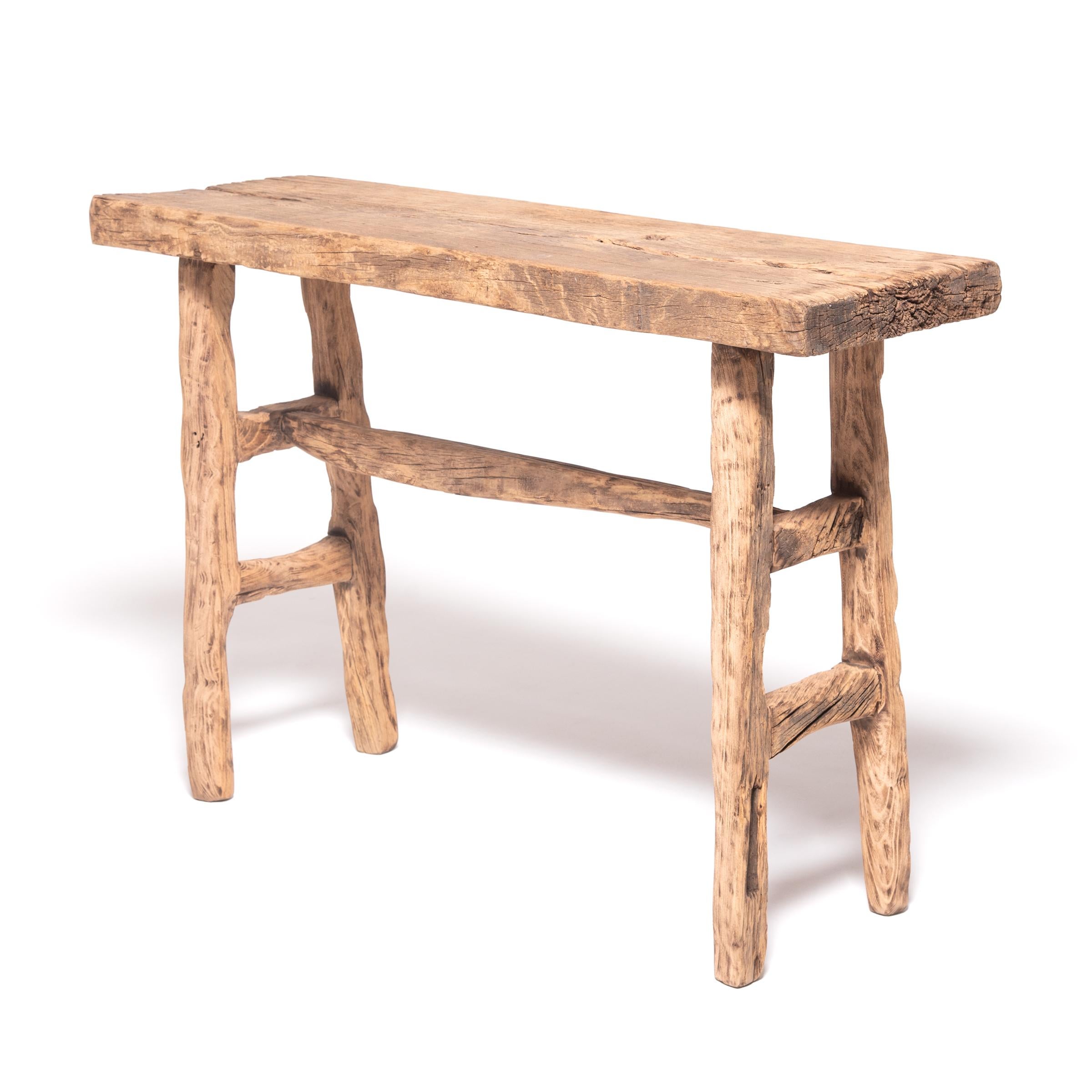 Made of wood reclaimed from 18th century Chinese buildings, this contemporary altar table is the epitome of farmhouse modern. Skilled in traditional joinery techniques, our craftspeople fashioned a simple, portable table, much like those that would