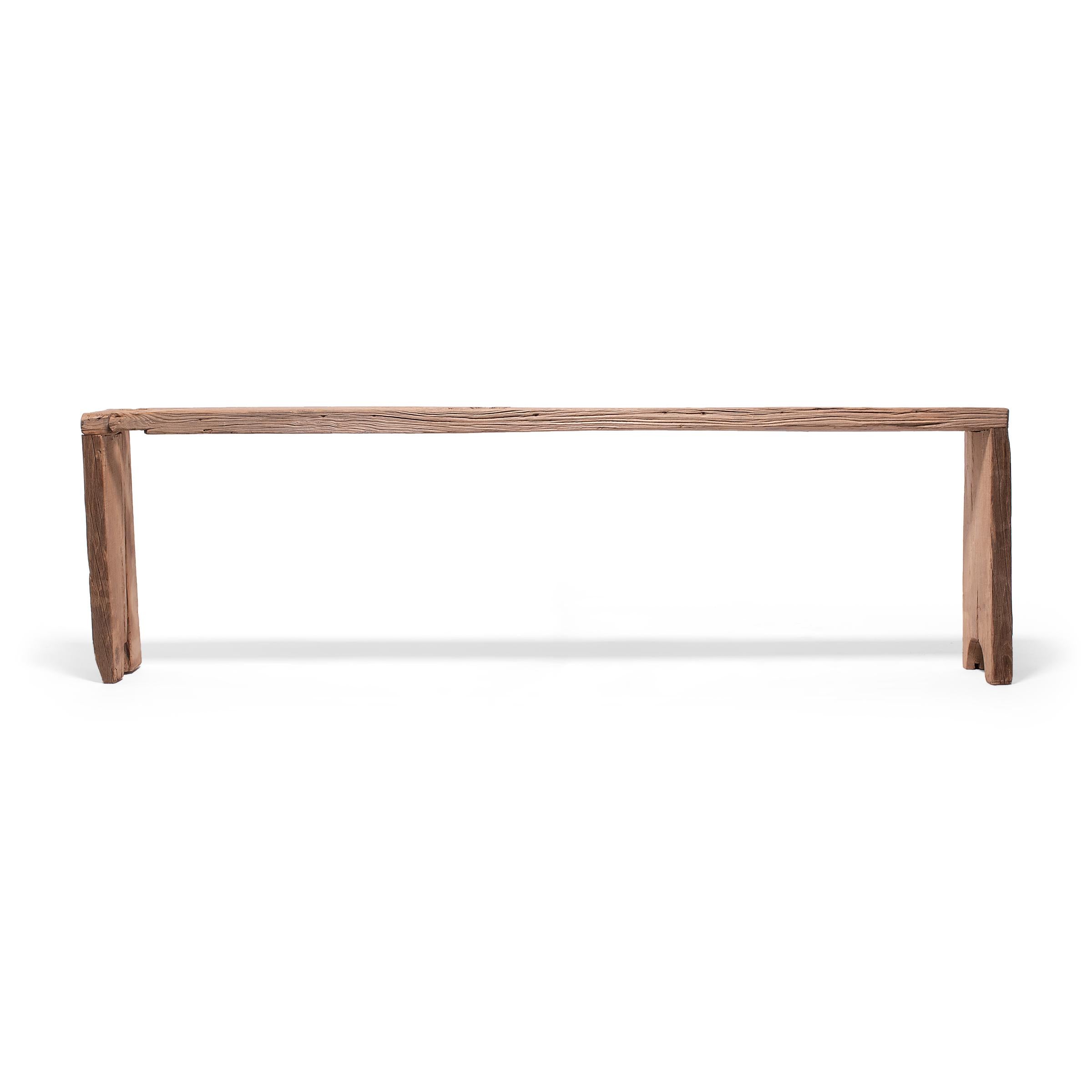 Made of wood reclaimed from Qing-dynasty architecture, this long contemporary altar table is a celebration of wabi-sabi style. In the spirit of traditional Chinese joinery, the corners are finished with dovetail joints for a modern waterfall design.