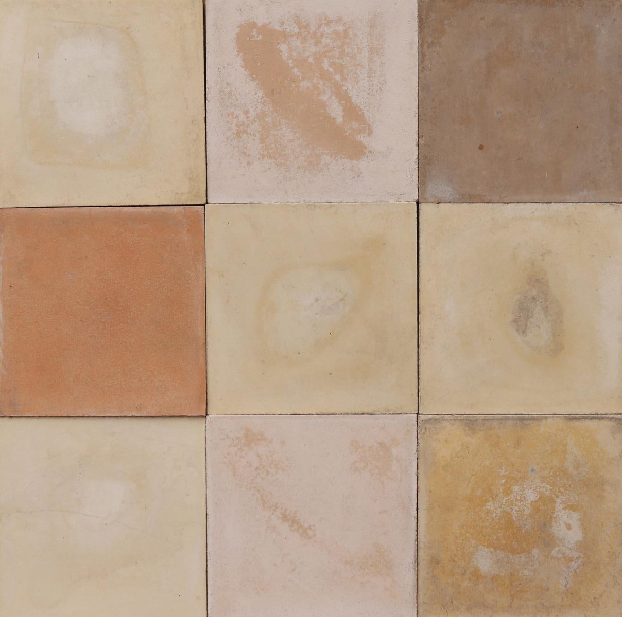 A batch of 342 reclaimed encaustic cement tiles suitable for use on floors or walls. These tiles will cover 13.6 m2 or 146 sq ft.

Mixed shades of cream, including some more orange and yellow.

Weathered surfaces and small chips associated with