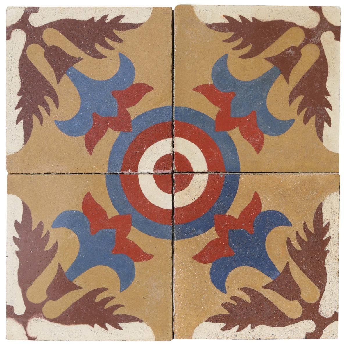 A set of 76 reclaimed encaustic cement tiles featuring a floral, bulls-eye pattern, in blue, red, white, olive and brown colours. These tiles will cover 3 m2 or 32 sq ft.