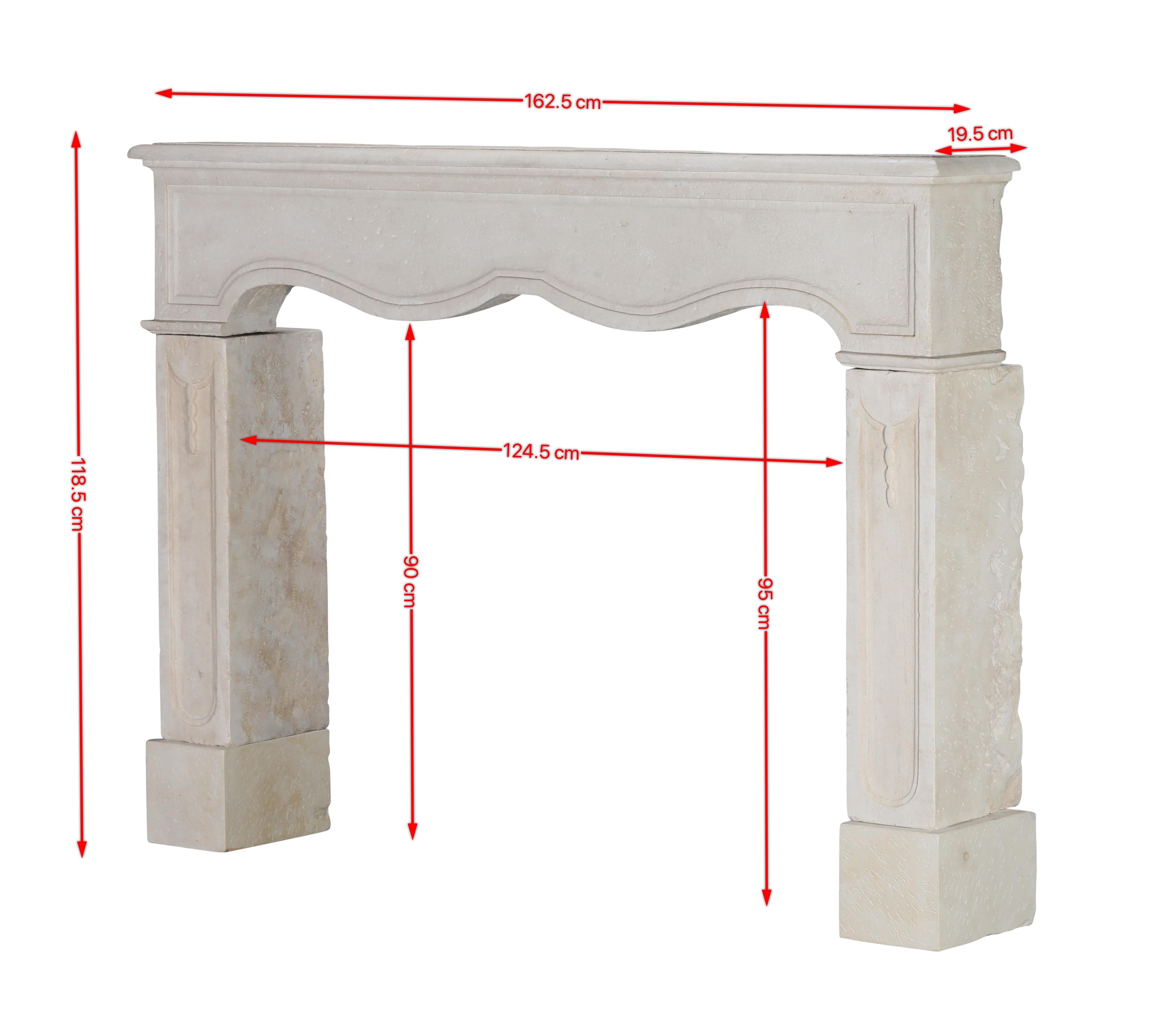 Hand-Carved Reclaimed French Light Stone Fireplace In Timeless Louis XIV Style For Sale