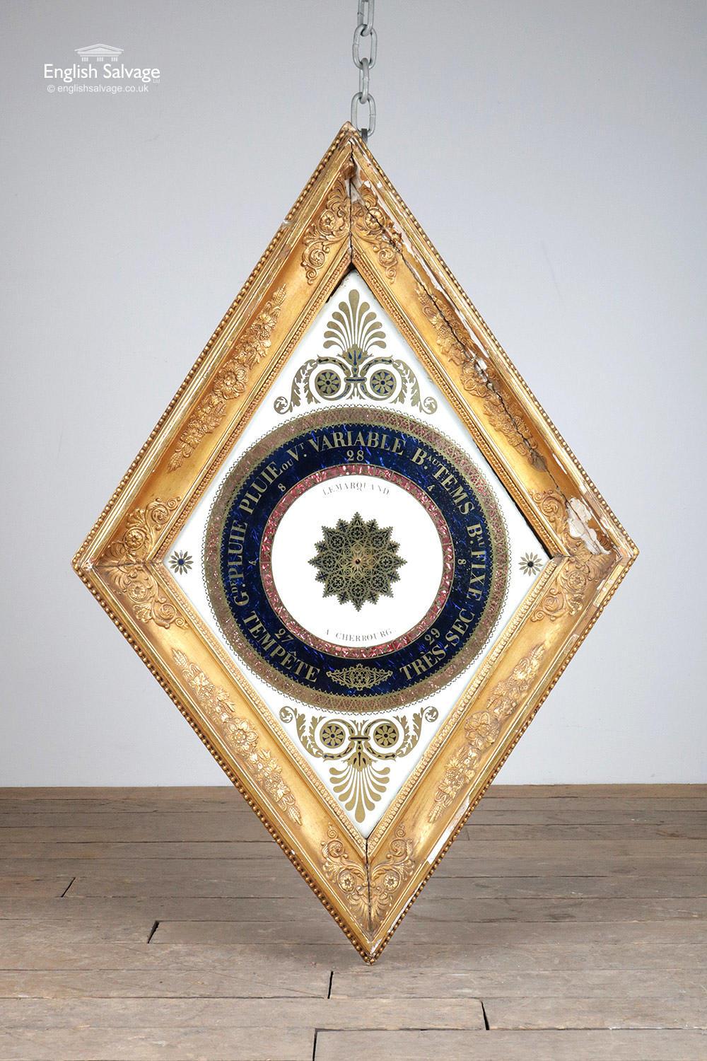 An antique French diamond / lozenge shaped barometer with navy blue weather section, gilt lettering and moulded frame. Some loss to the frame and slight separation. Marked Lemarquand a Cherbourg. Beautiful colors and detail throughout.