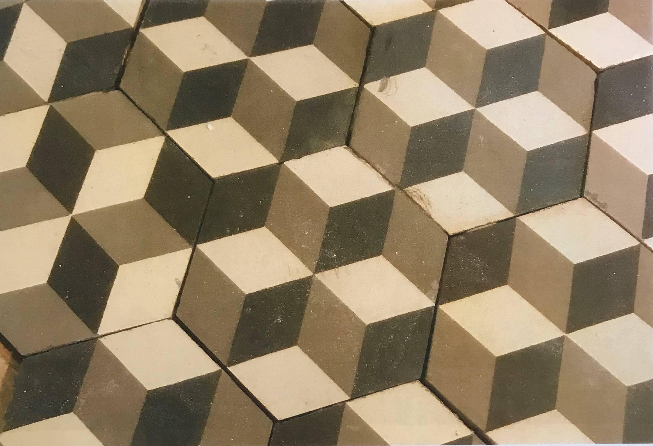 Dating back to early 1900 these geometric French tiles offer a dazzling three-dimensional illusion. Unlike the square replica's', these hexagon tiles allow for your eye to focus on different color patterns rather than a grout lines. With 110 square
