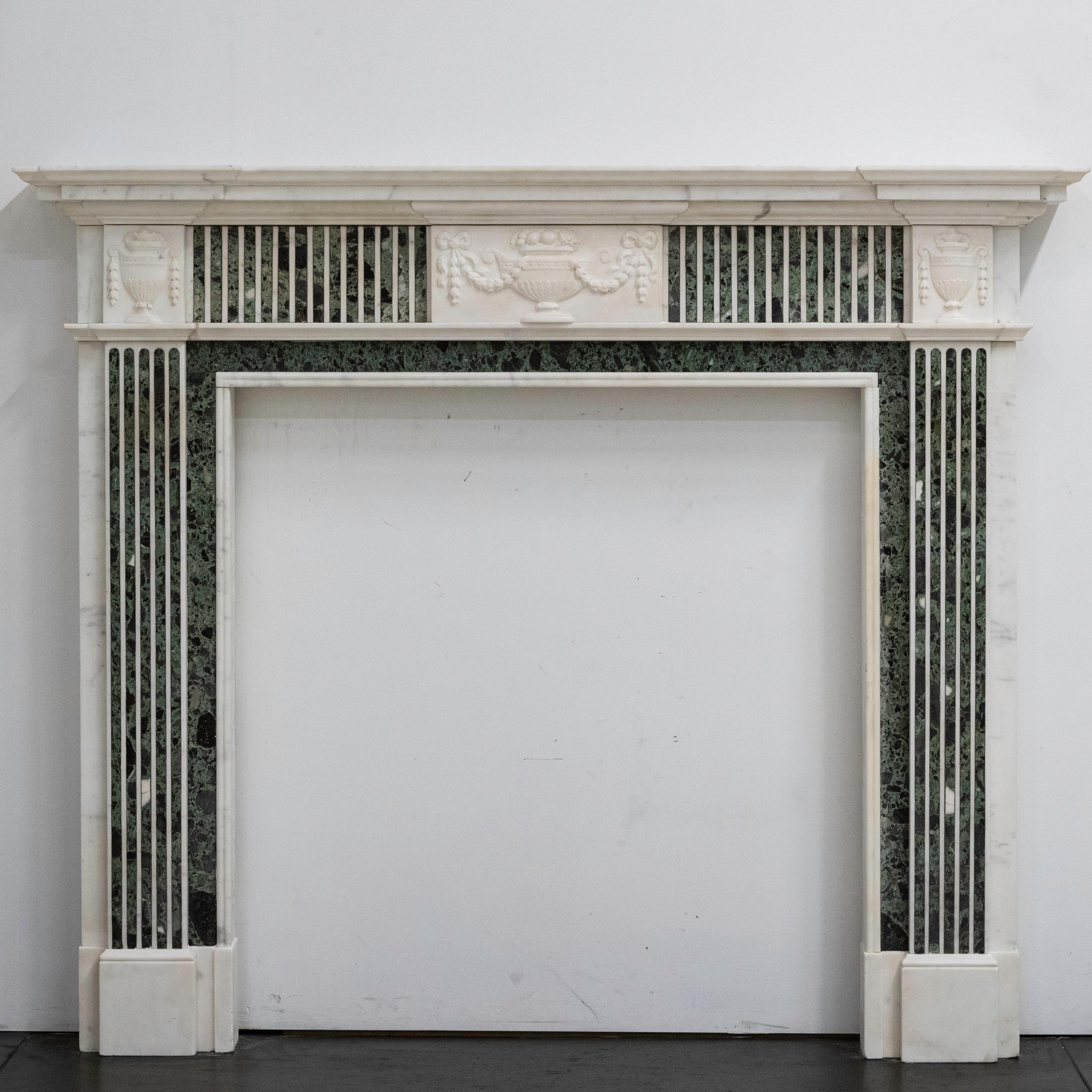 An impressive reclaimed Statuary marble fireplace surround with Verde marble inlay. We currently have a matching pair of these surrounds (ARMSTRONG & DARLING); both were reclaimed from the same London property. 

An exceptional piece, the surround