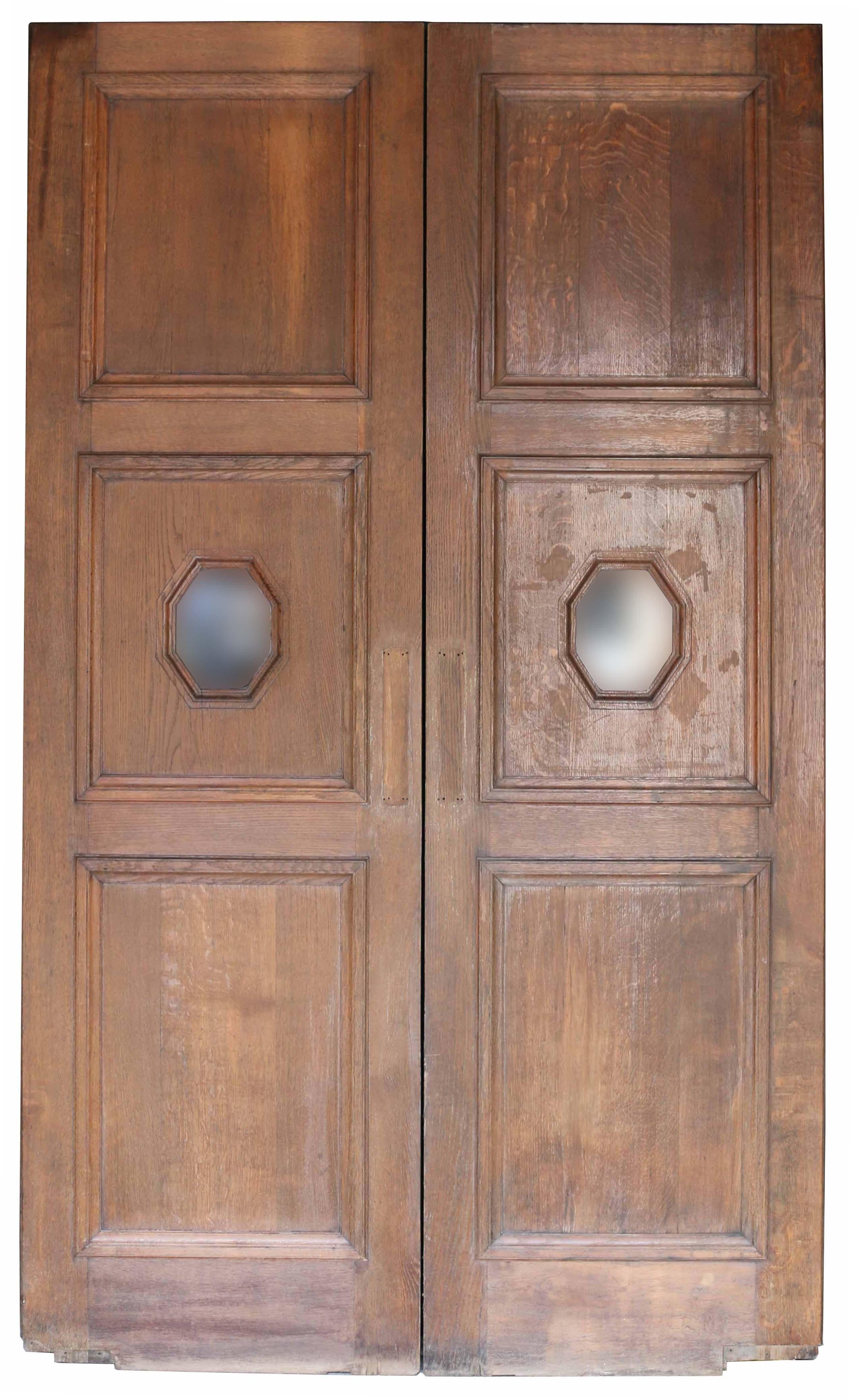 A pair of large reclaimed oak doors previously used in a restaurant.