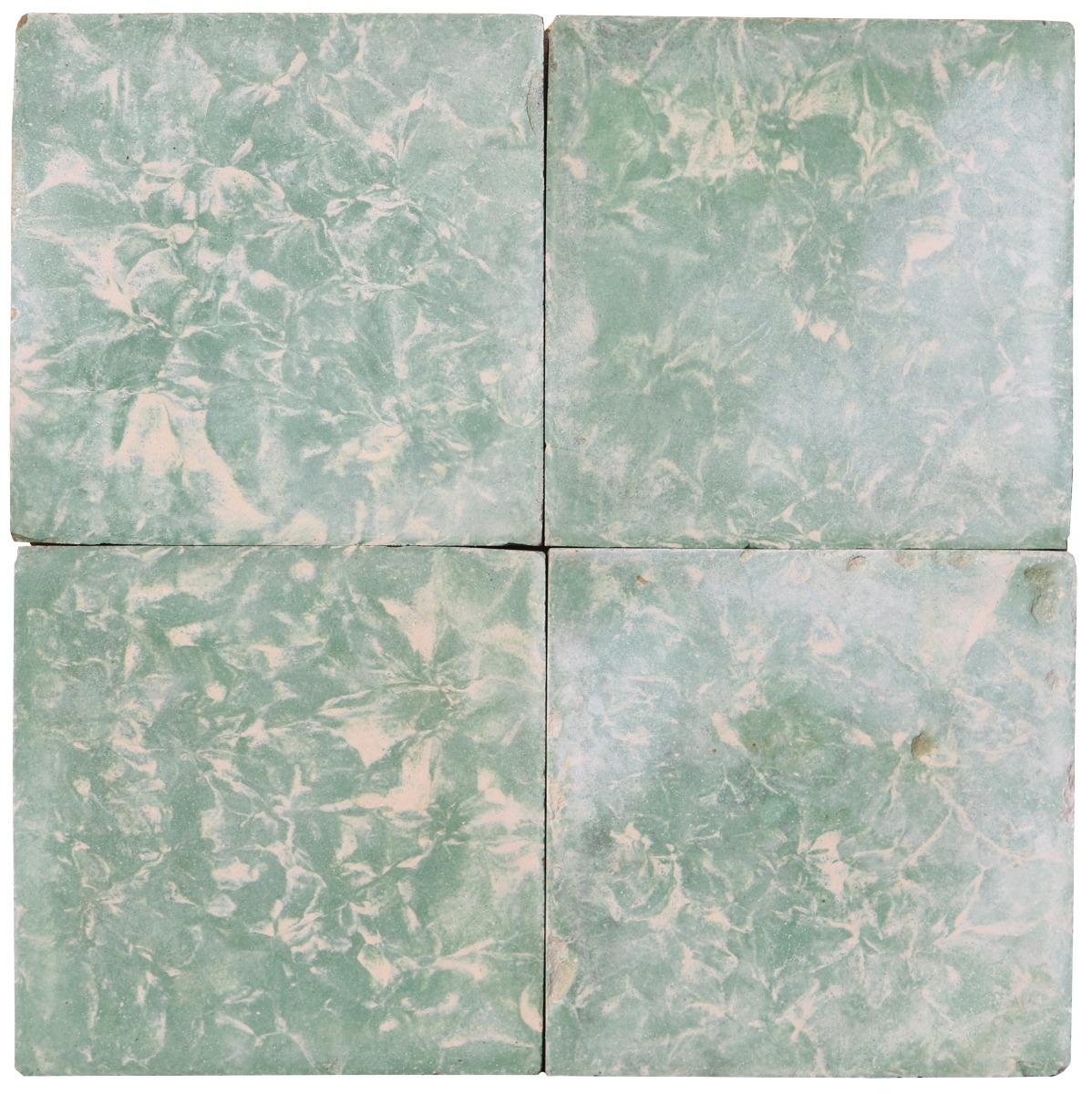A set of 182 reclaimed cement floor tiles featuring a pale green marble finish. These tiles will cover 11.4 m2 or 122 sq ft.