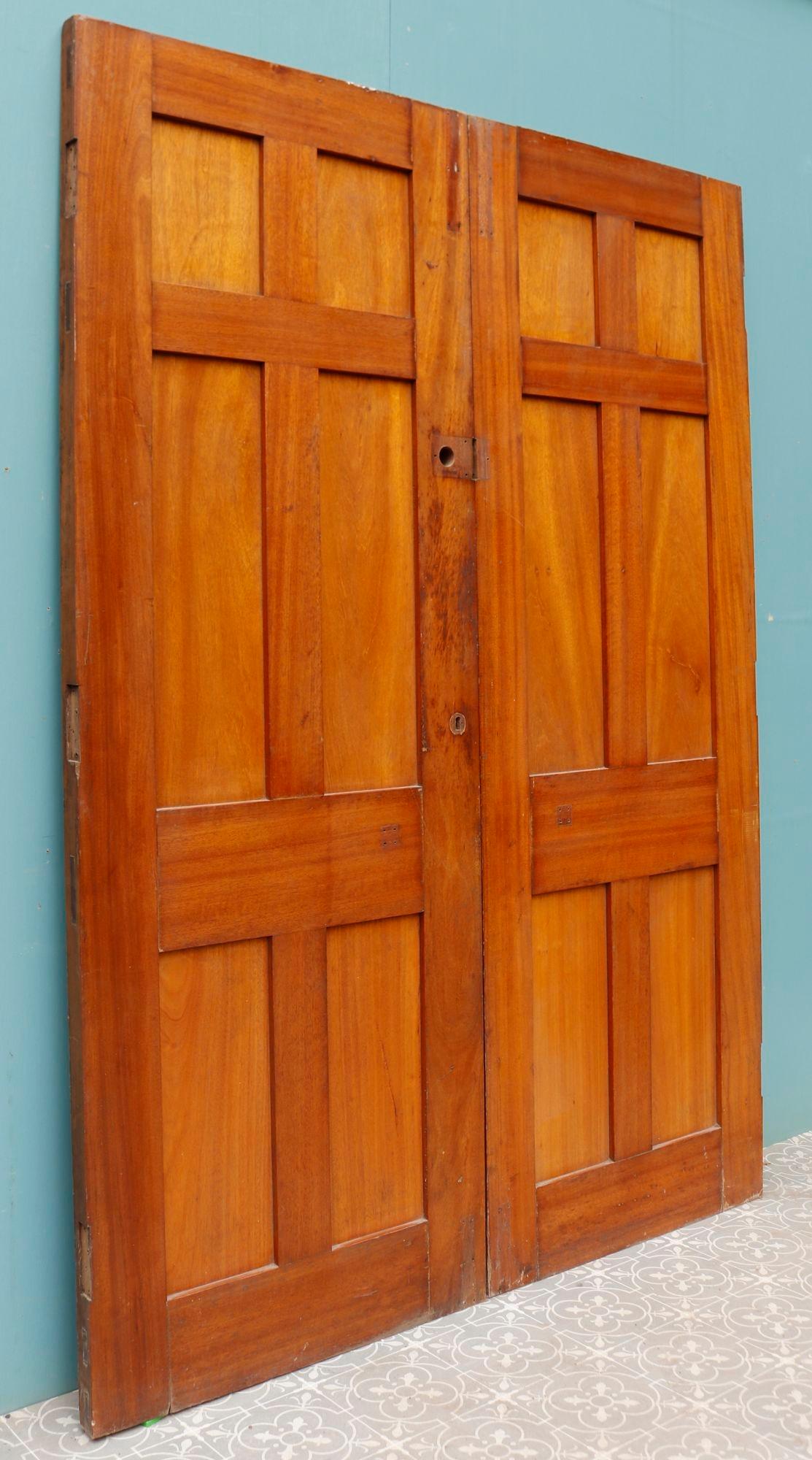 A pair of reclaimed 1950s hardwood doors.

These were originally front doors.
