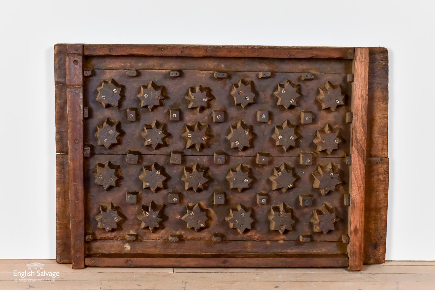 Reclaimed grill mould in teak. It is rustic and simple in design with hand carved stars and squares screwed on to the board base. This unusual item could be put back to work as mould or used as a decorative piece.