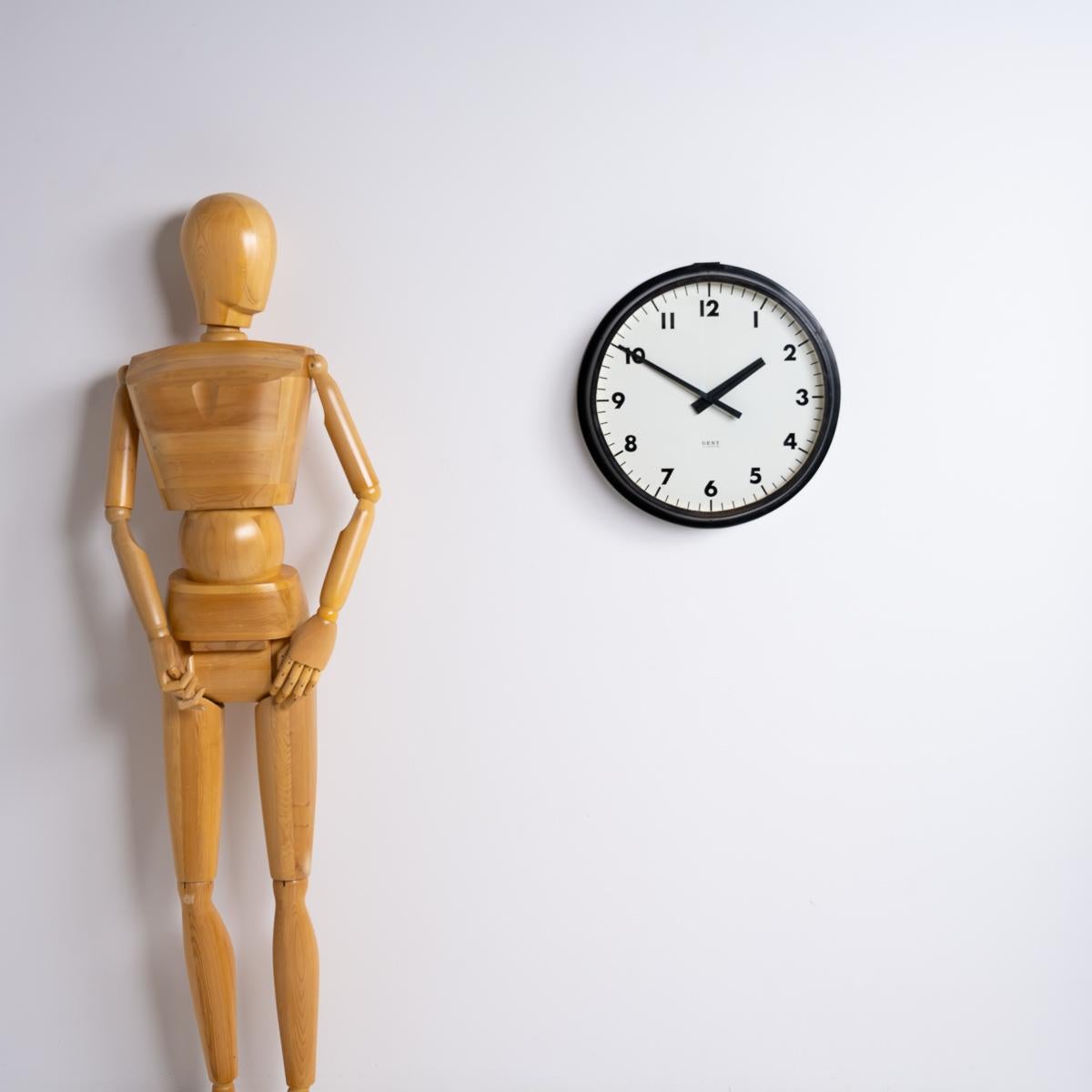 A Large Vintage Gents of Leicester Factory Wall Clock.
A clean example of the iconic Gent of Leicester industrial wall clock.

Made in Leicester, England circa 1960 by Gents of Leicester.

An black painted steel case clock with trademark Gents