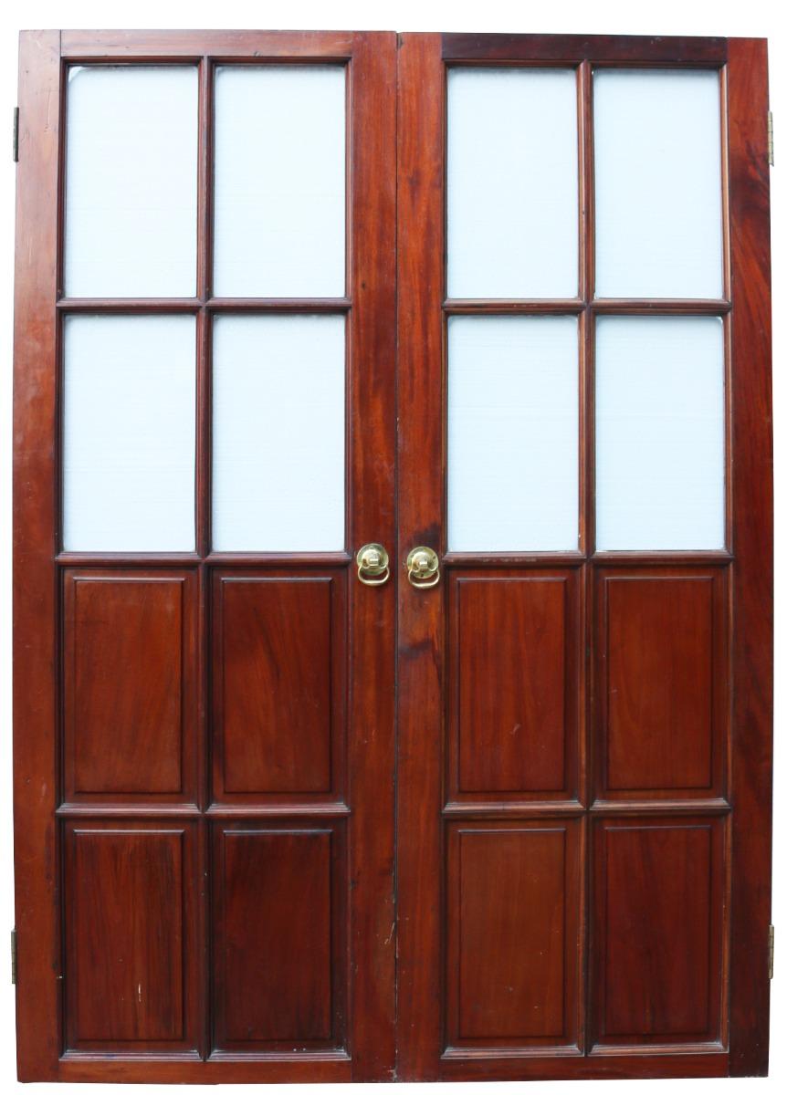 A pair of Victorian French polished Mahogany double doors. Half glazed design with raised and fielded
Mahogany panels to the base.