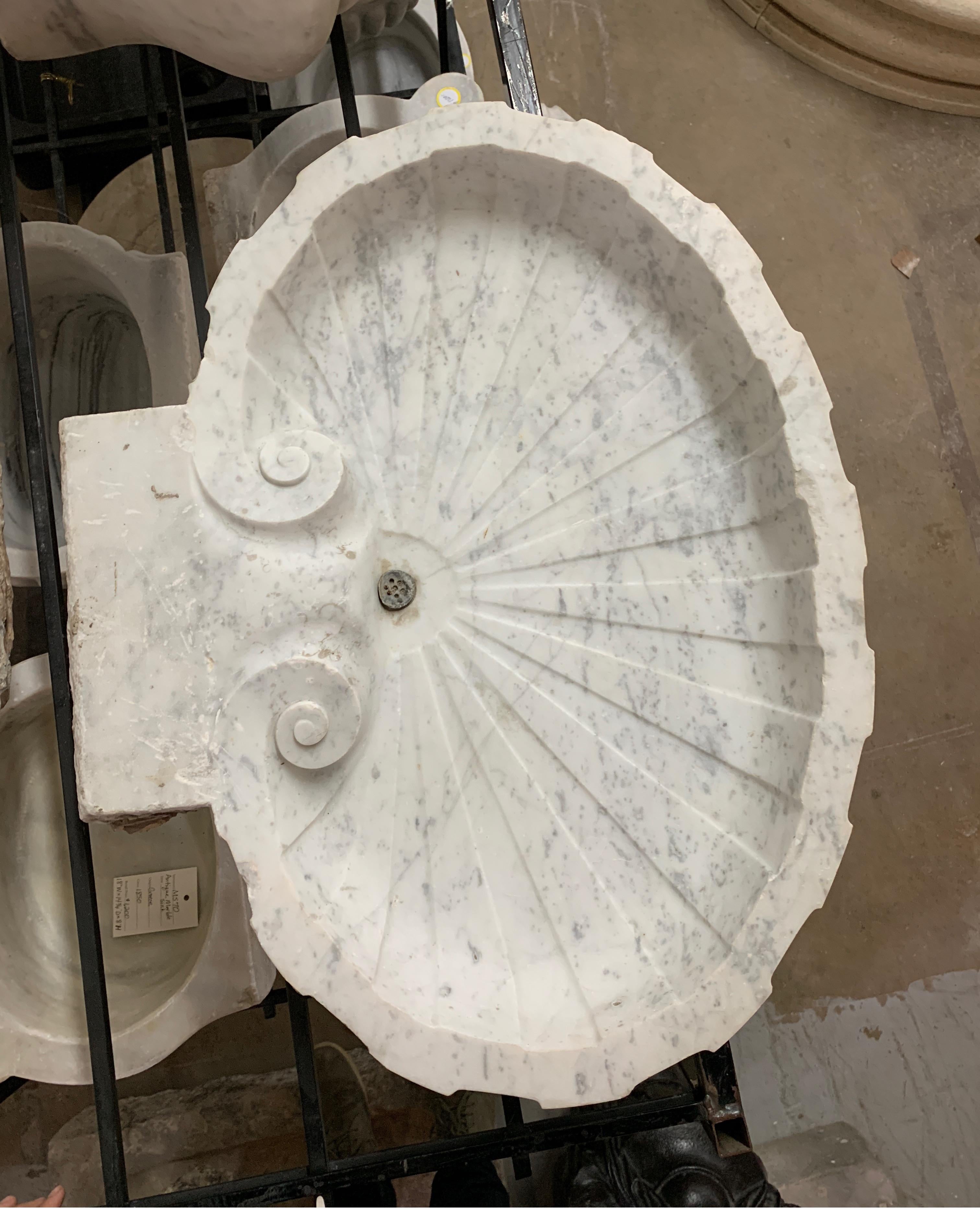 Reclaimed marble shell sink.