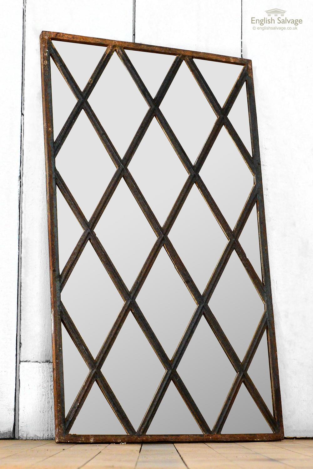 Rectangular mirror made from a repurposed metal window. Surface rust to frame but solid.