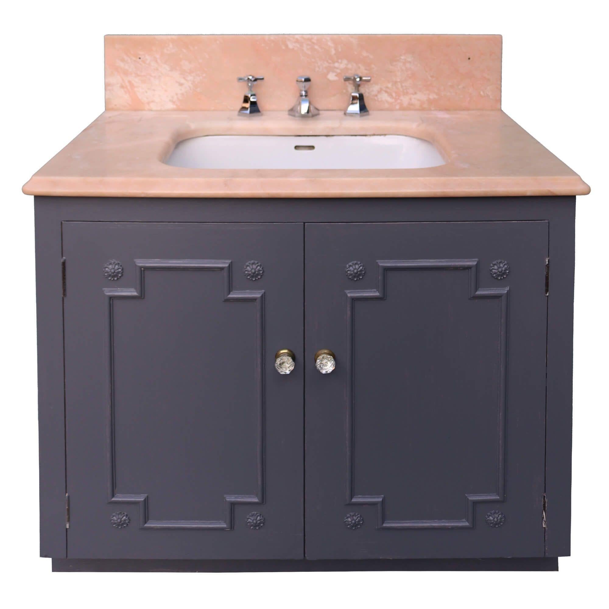 Reclaimed from a property in Haywards Heath near Brighton UK, this marble sink with cabinet is an impressive feature for a mid-century or Art Deco style bathroom. It comprises of a 1950s peach veined marble sink by John Bolding and Sons – 19th and