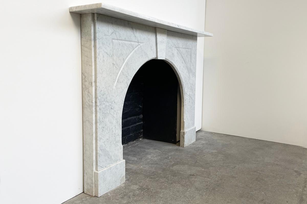 arched marble fireplace surround