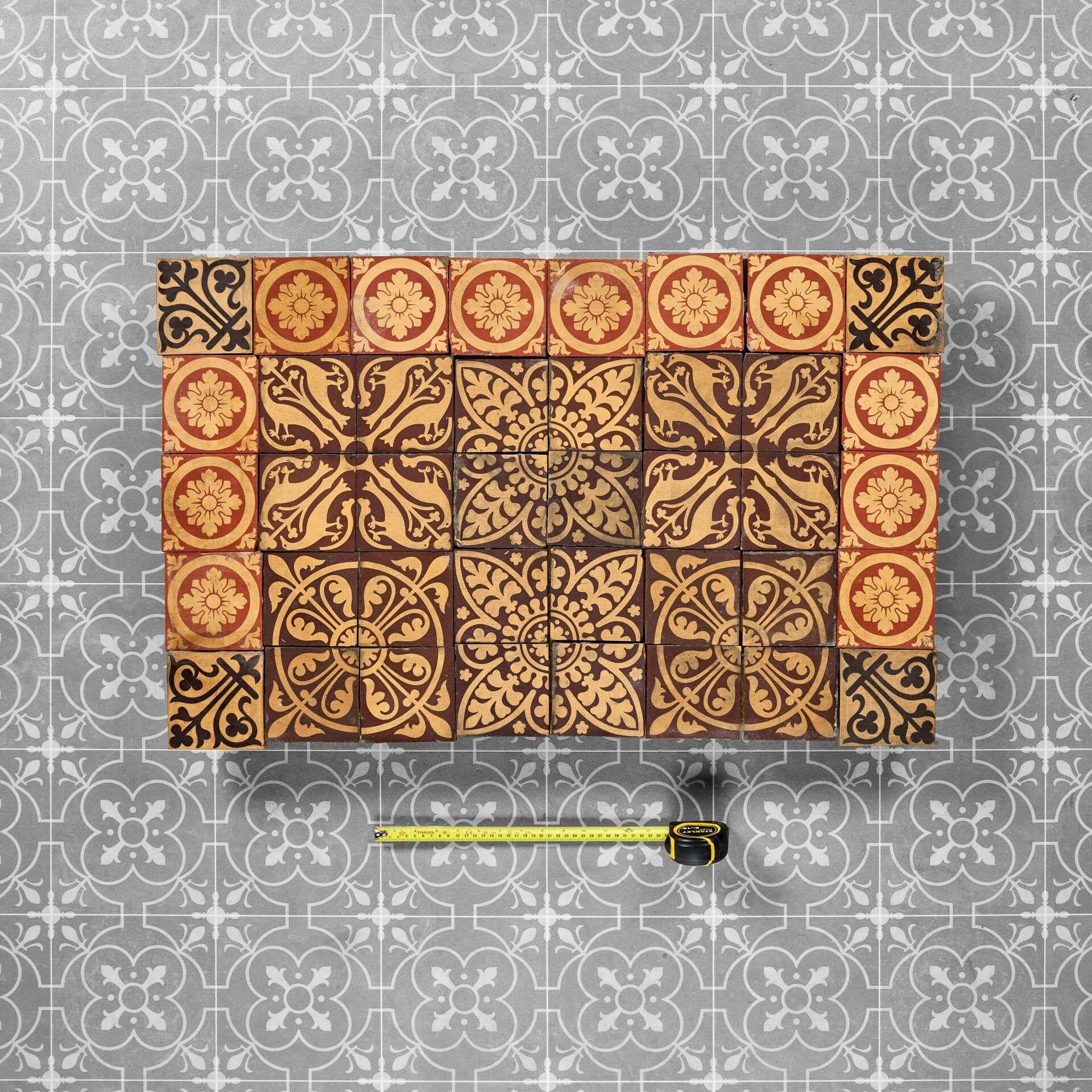 A set of 40 reclaimed Minton tiles, ideal for use as an antique tile splashback, entranceway floor or fireplace hearth in a period cottage or Victorian era property. While we have arranged these antique tiles as pictured, they are not fixed and can