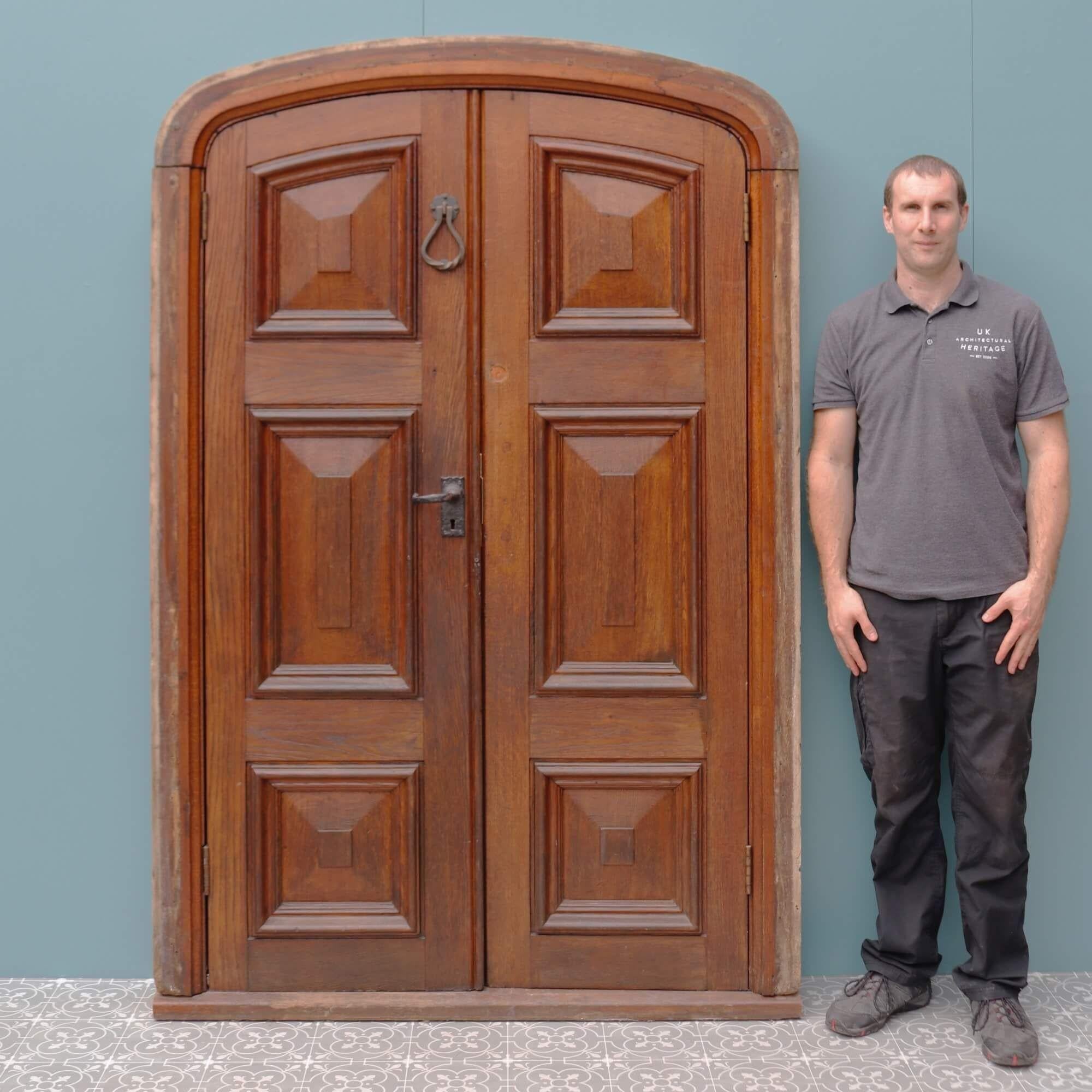 Originating from the early 1900s, this set of handsome oak double front doors make quite the statement at the entrance of an Edwardian or Victorian property. Made in solid oak, these reclaimed external doors and frame have stood the test of time,