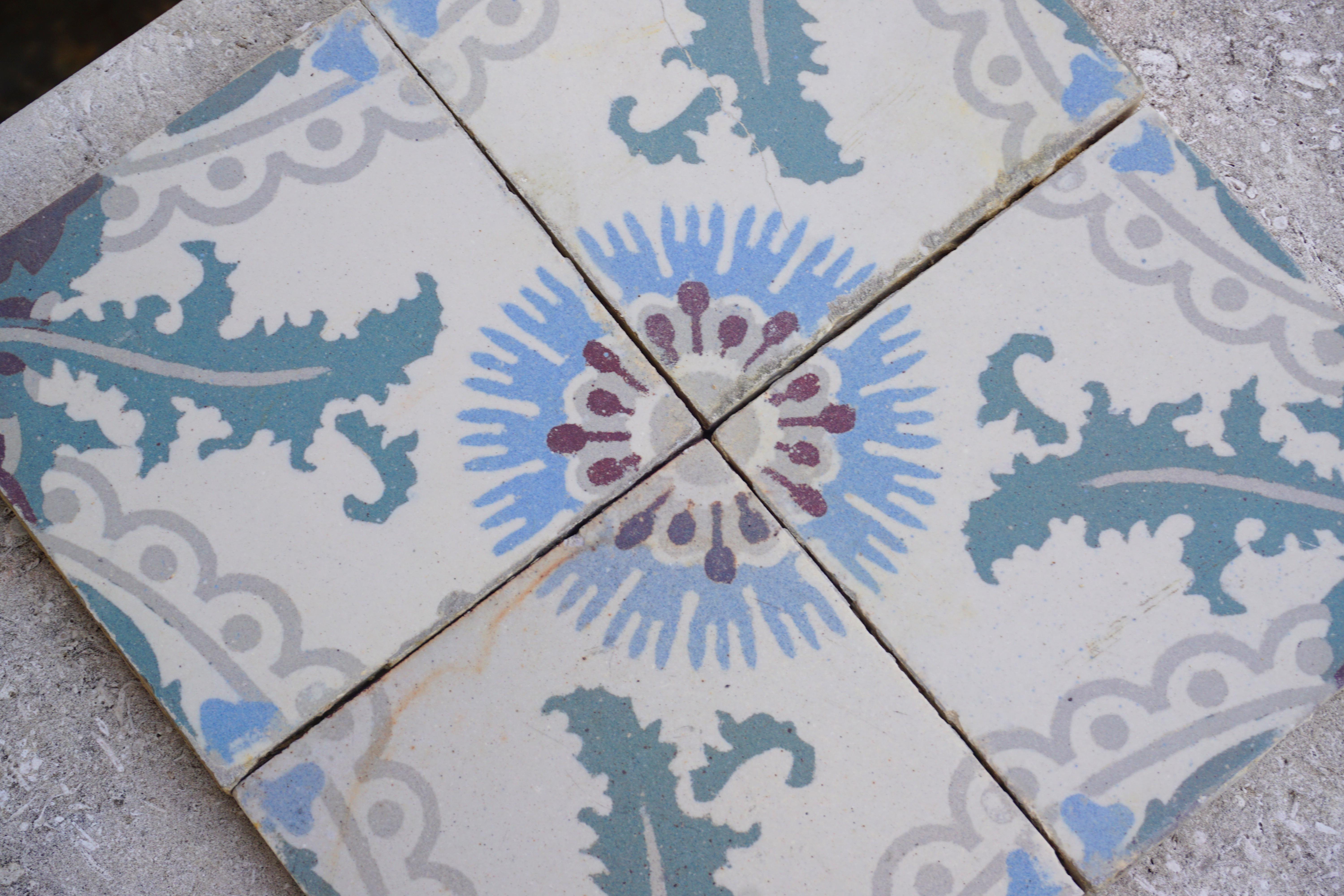 Hand painted, antique stone tiles. 

Total lot of 670 pieces, 100 square feet, each piece measuring 5'' x 5''.