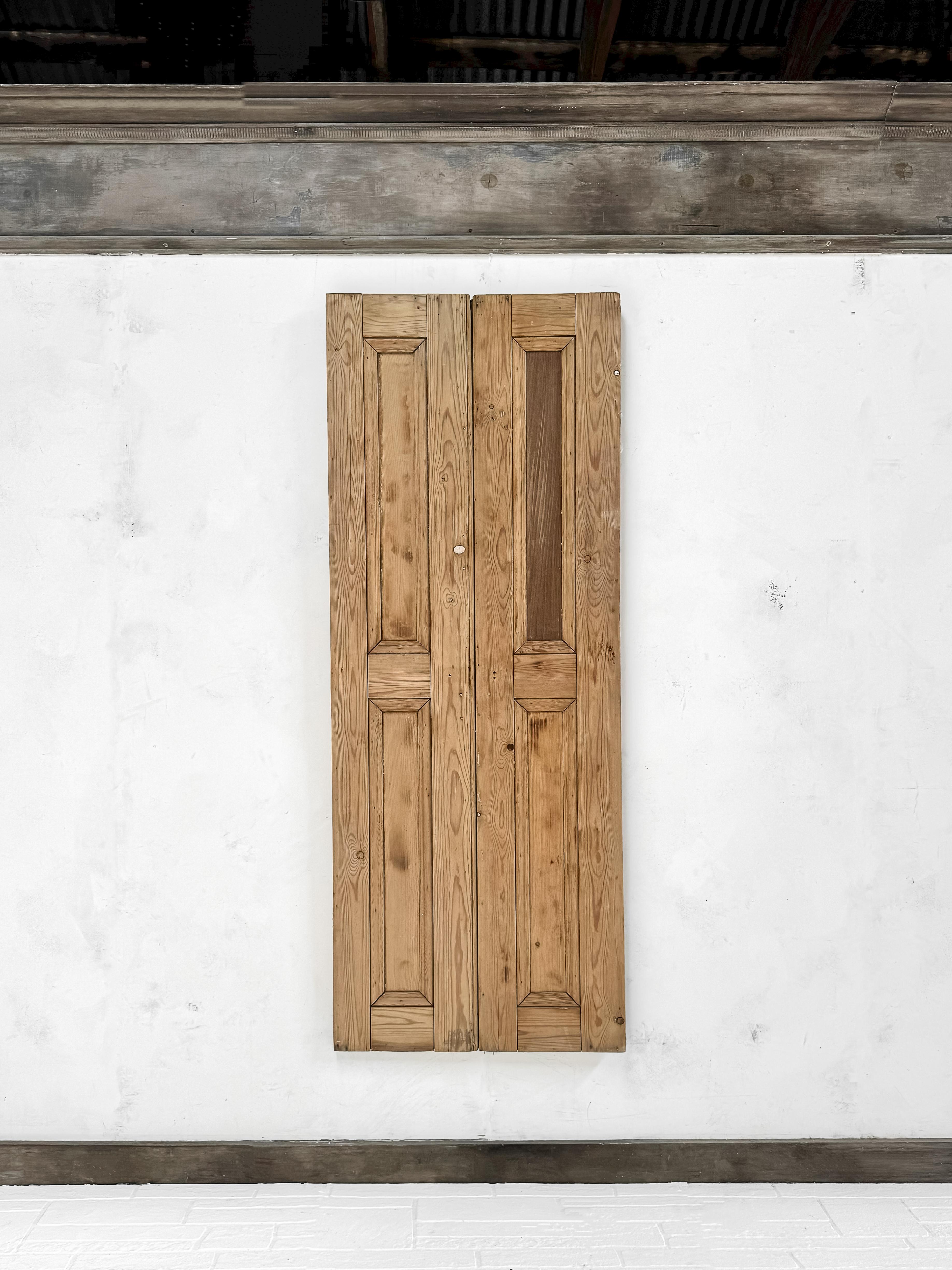 A pair of reclaimed 2-panel cupboard doors having beveled trim details. Enclose a built-in cabinet with this charming pair of doors to add warmth and infuse your home with a touch of history and character.

Salvaged in England, 19th