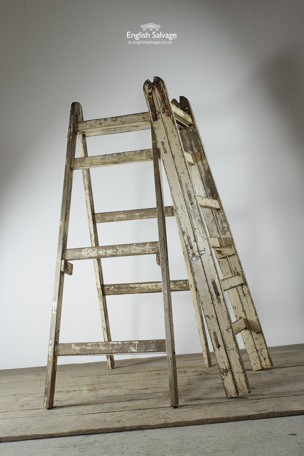 Reclaimed pair of wooden trestle ladders with a distressed paint finish and trestle hinges. Both ladders also feature a badge which reads 'An Eclipse Product'. Could make great shelving units in a shop or restaurant.

The width listed refers to