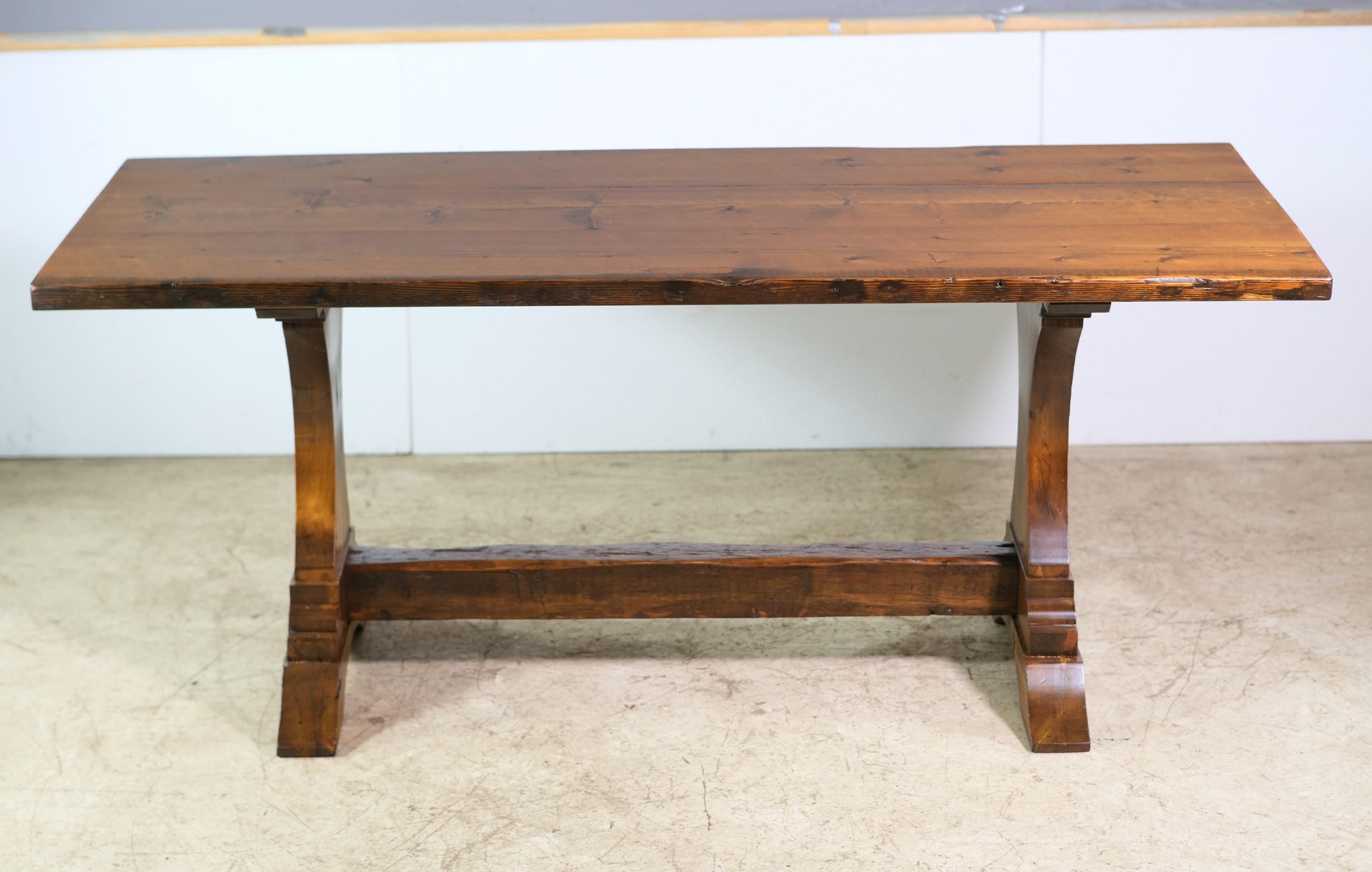 Newly made farm or harvest table made from reclaimed pine. Table features trestle legs. Nice and sturdy. This can be seen at our 400 Gilligan St location in Scranton, PA.