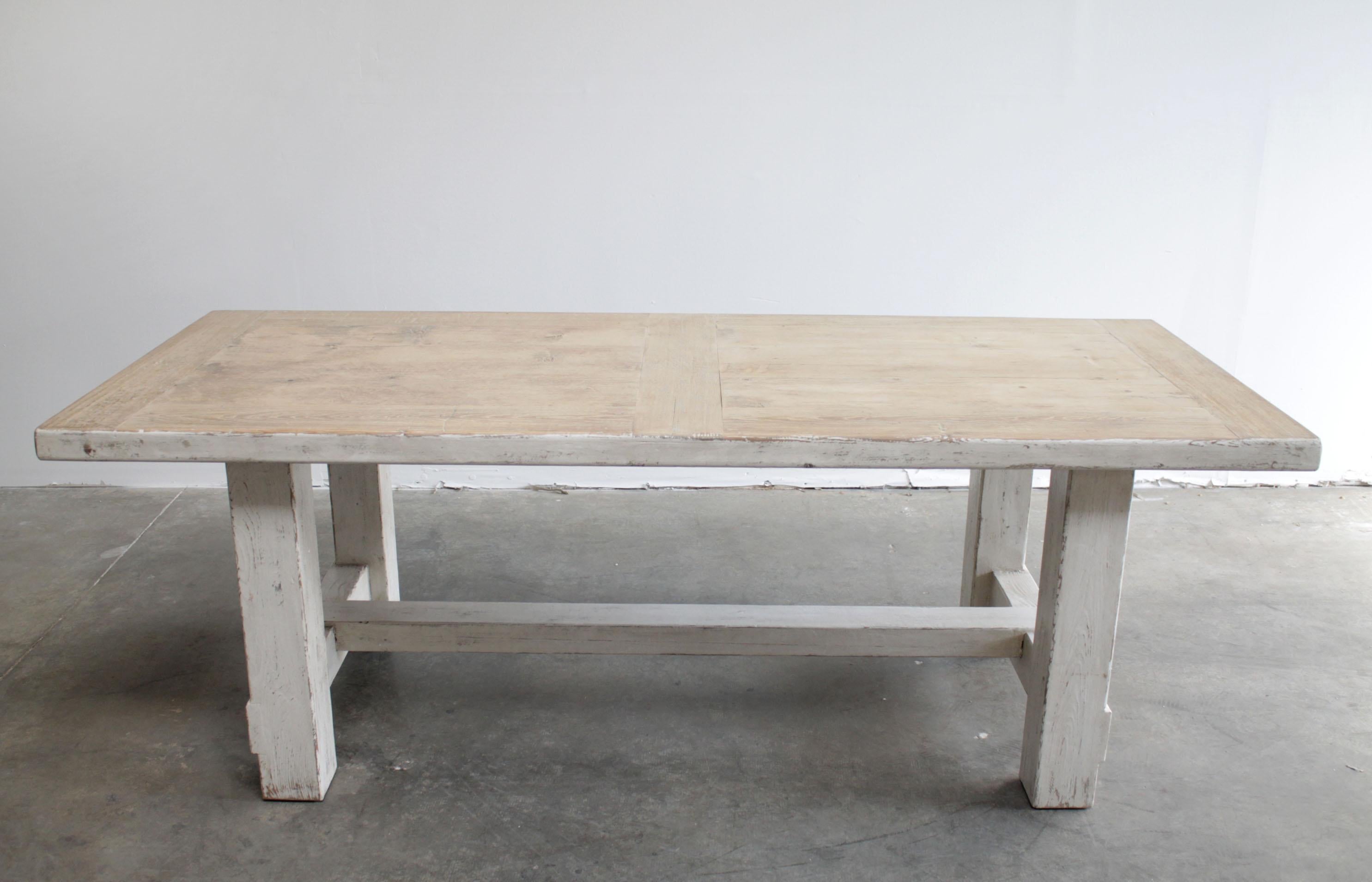 Reclaimed pine wood Farm House style dining table with distressed white paint
Legs and apron are finished in an antique white washed distressed paint, with a natural distressed pine top.
Measures: 35.5