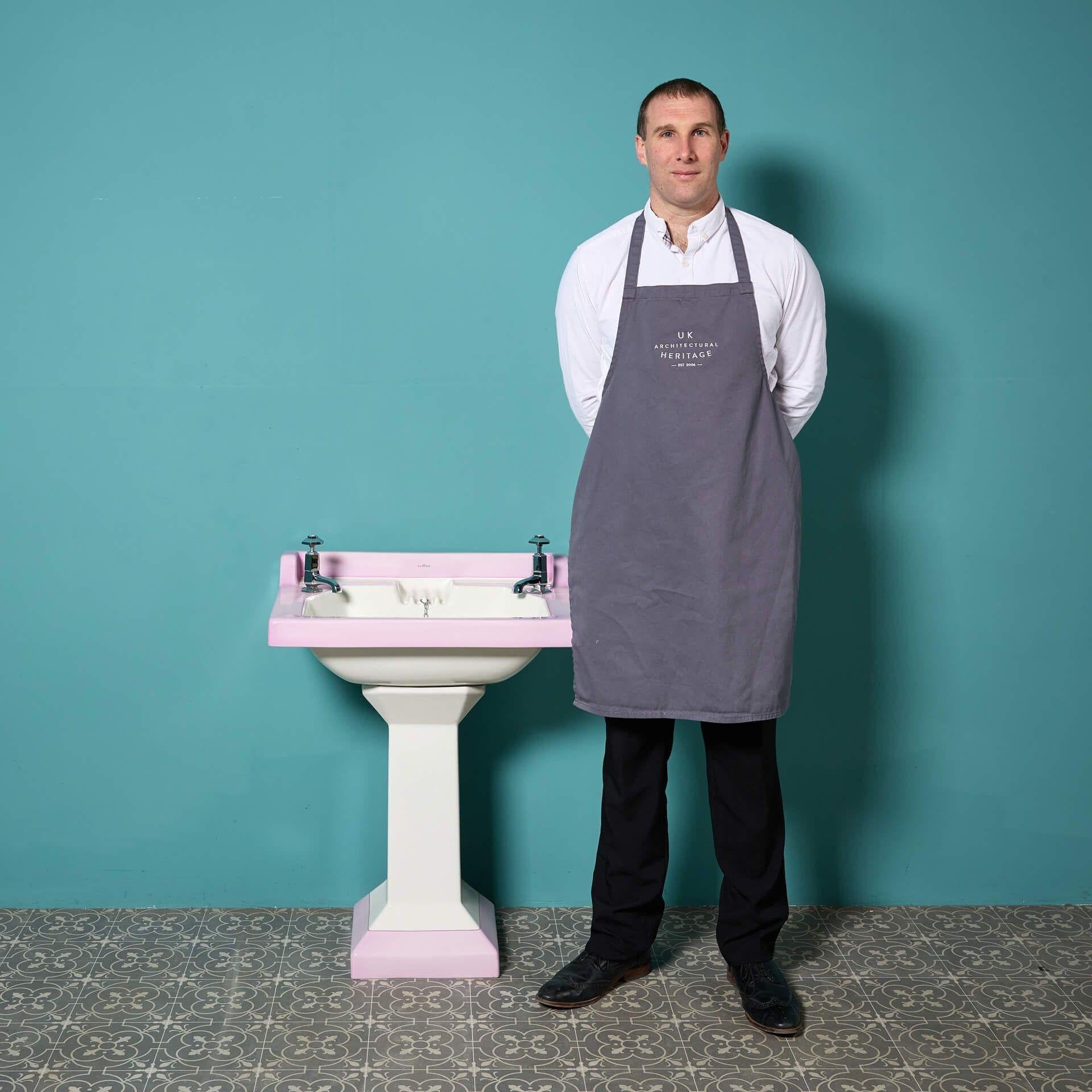 A reclaimed Pountney & Co Illustrous pedestal sink with rare octagonal taps, raised splash back and sweeping pedestal from the Simon Kirby Museum of Bathroom Sanitaryware.

Originating from early 20th century England, this striking sink showcases