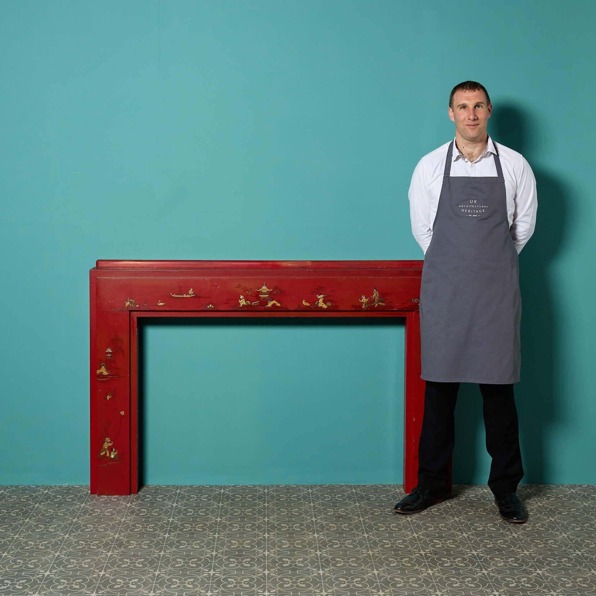 A reclaimed red Chinoiserie painted fireplace. A fire surround as striking as this would suit both modern and traditional interiors alike.

It has unique design showcasing style and form. The frieze and jambs are adorned with detailed painted