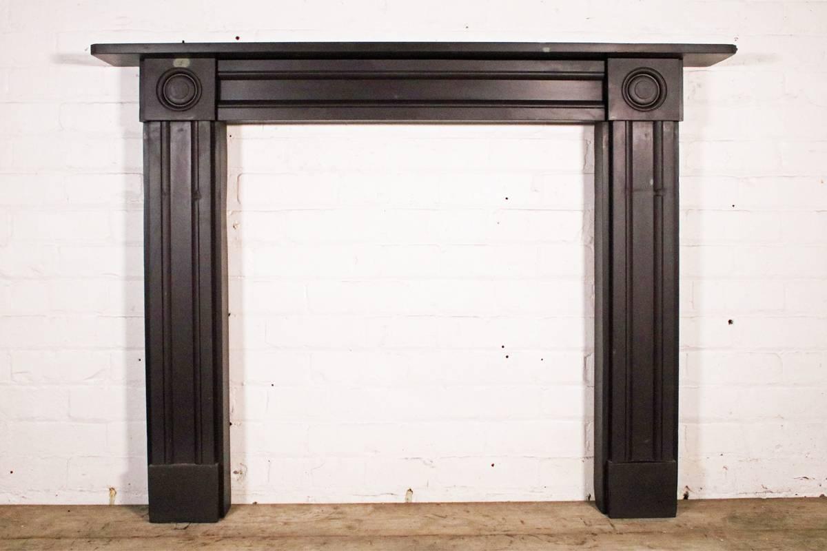 Lovely reclaimed Regency bullseye slate fire surround, circa 1820. From Welsh heather blue slate showing great natural inclusions and signs of love and age. The rubbed grooves on the leg faces are a result of hundreds of bottoms sitting on a club