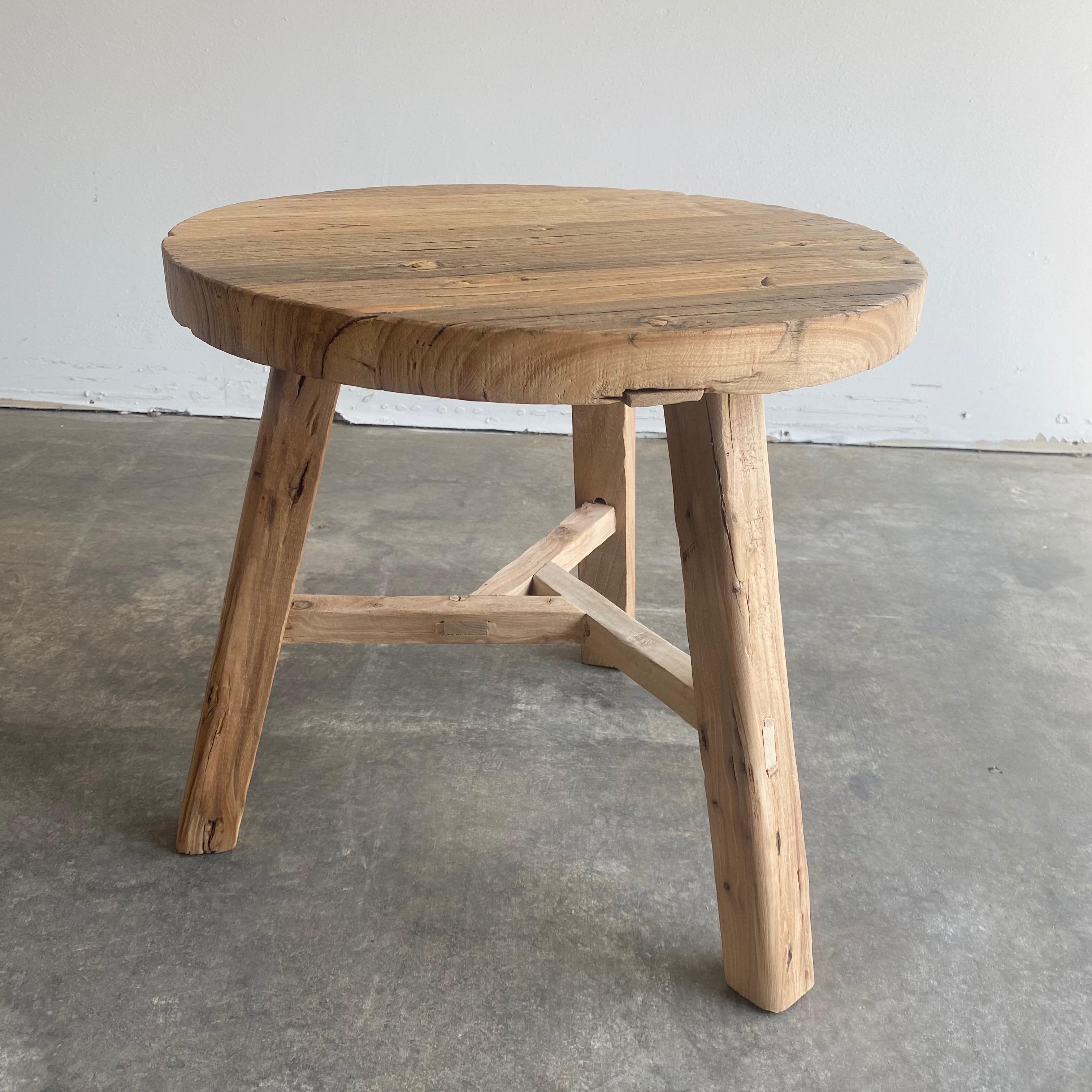 Round natural side table made from reclaimed elmwood Raw natural finish, a warm honey with gray tones in the wood. Solid and sturdy, a great side table for next to a bed, sofa, chairs. Can be stained or painted for a customized look
 Size: 20