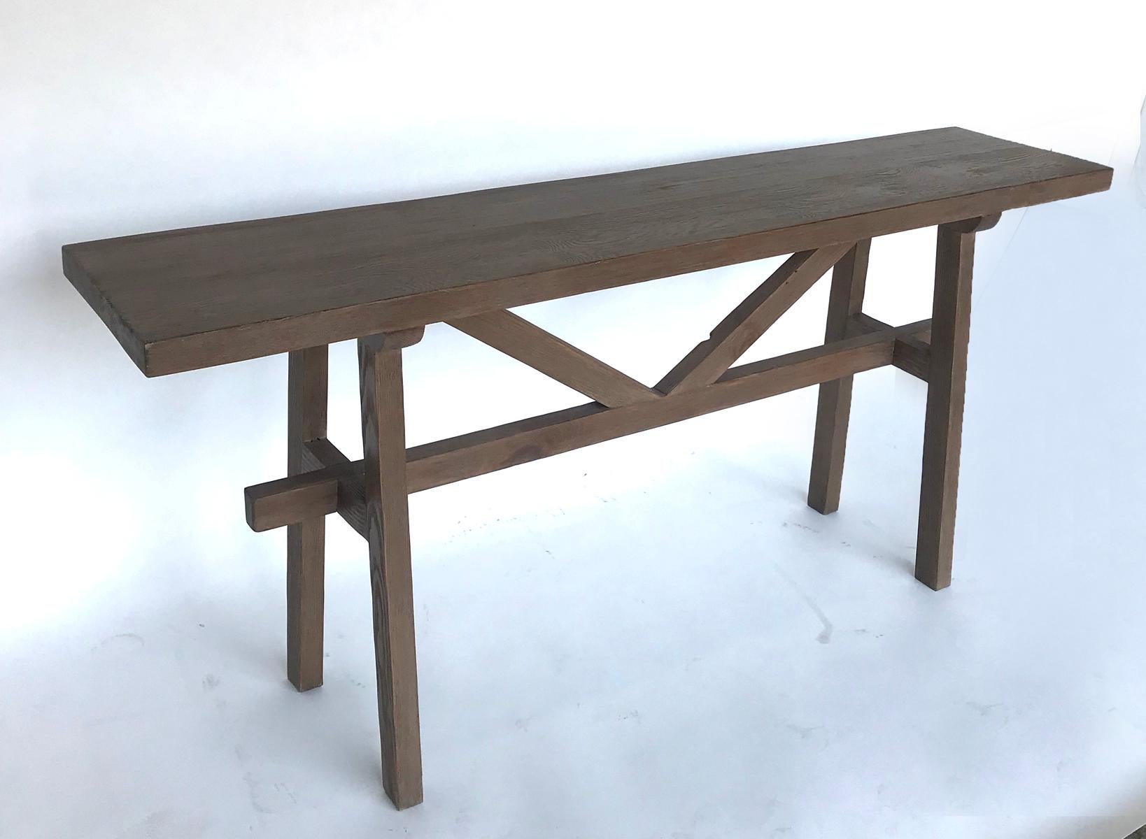 Available off the floor, this is a reclaimed Douglas fir console with a tall V stretcher. As shown in Dark Latte. This can be made in custom sizes and finishes. Made in Los Angeles by Dos Gallos Studio.