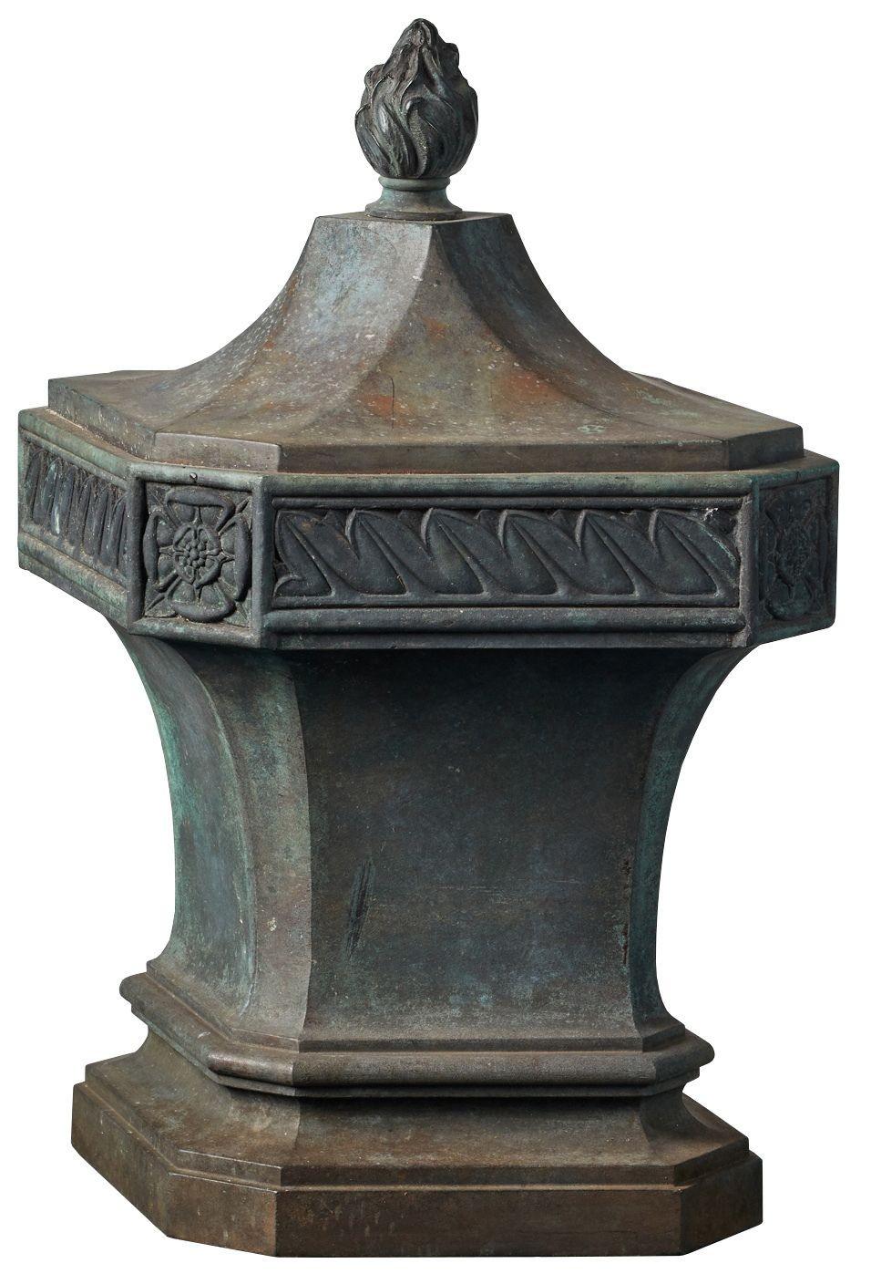 Antique shaped bronze finial. The lozenge shaped finial features a patinated Bronze finish with a flame styled cap. There is stylised foliage and Tudor rose decoration.