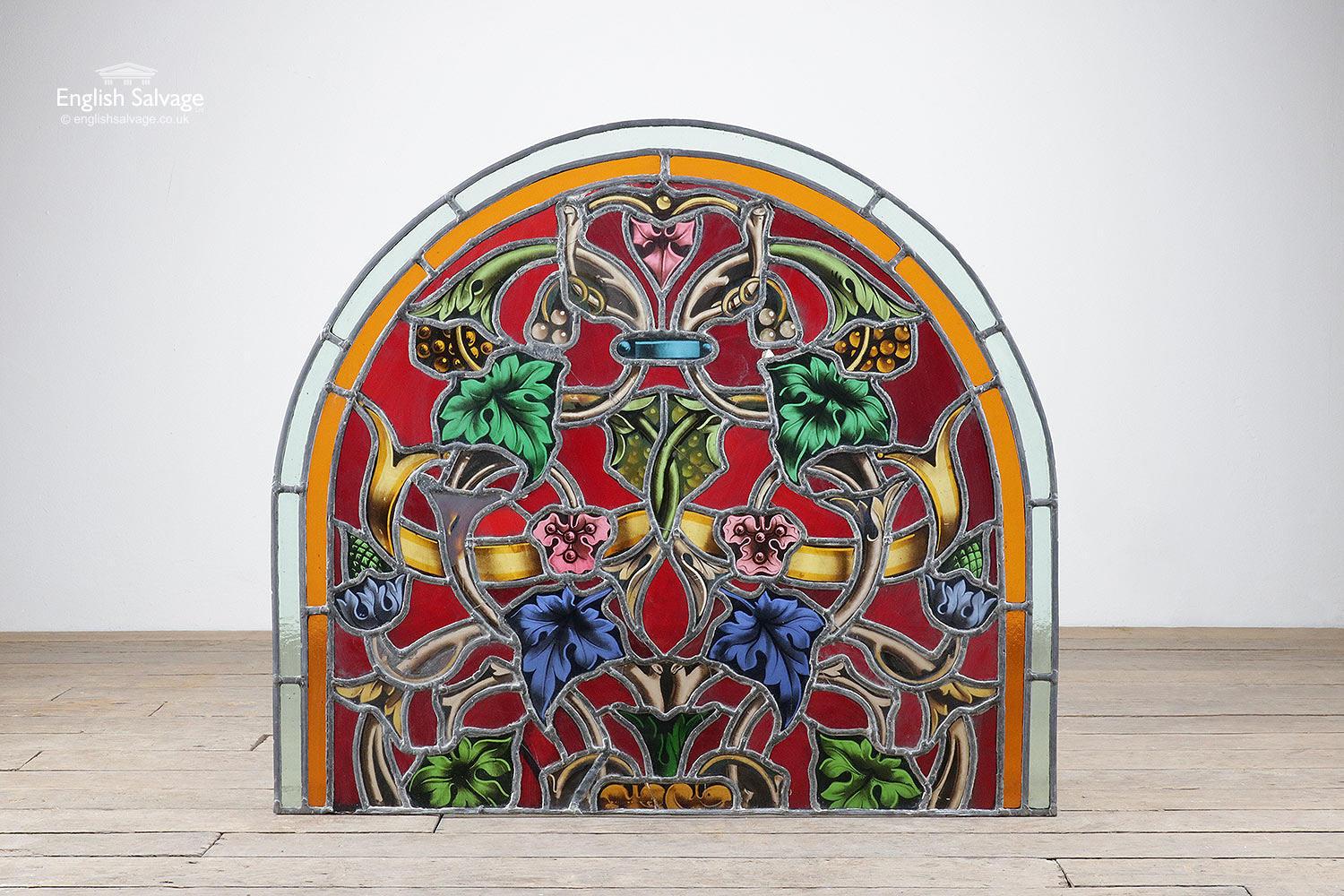 Arched leaded and stained glass panel with stunning colours and detail. Floral and foliate design. There are a few cracks to some of the glass but they are secure in the leadwork.