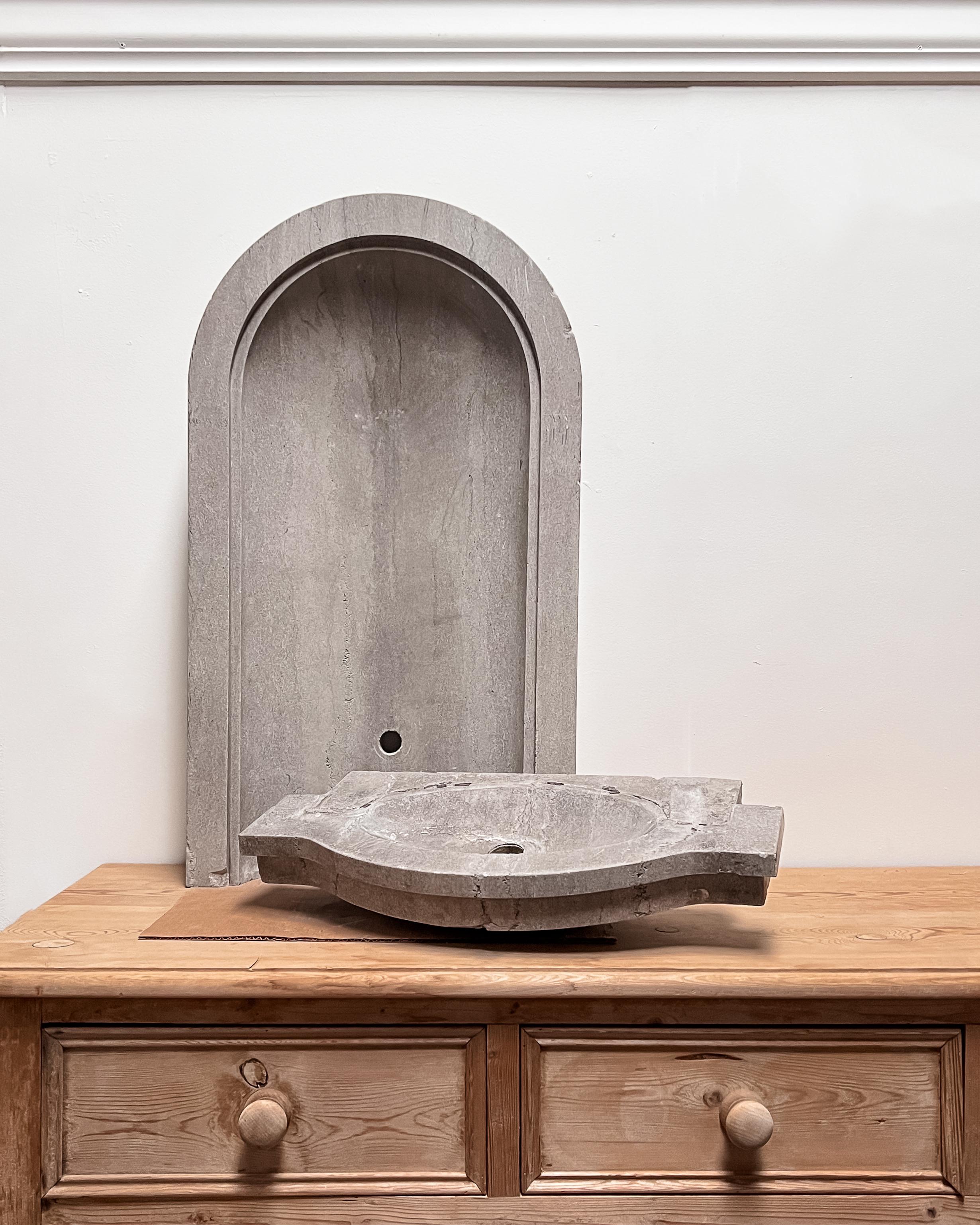 Reclaimed from the original Treasurer’s vault inside the Saline County Courthouse in Wilber, Nebraska, which was the ultimate in modern design when it was constructed in 1927. This unassuming blue-gray Carthage limestone wall fountain would make a