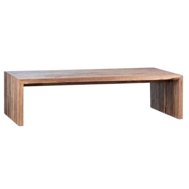 Enhance your living space with this reclaimed teak wood coffee table, boasting a rustic yet contemporary design. Crafted from sustainable materials, it features a simple rectangular shape with a natural finish that highlights the unique grain
