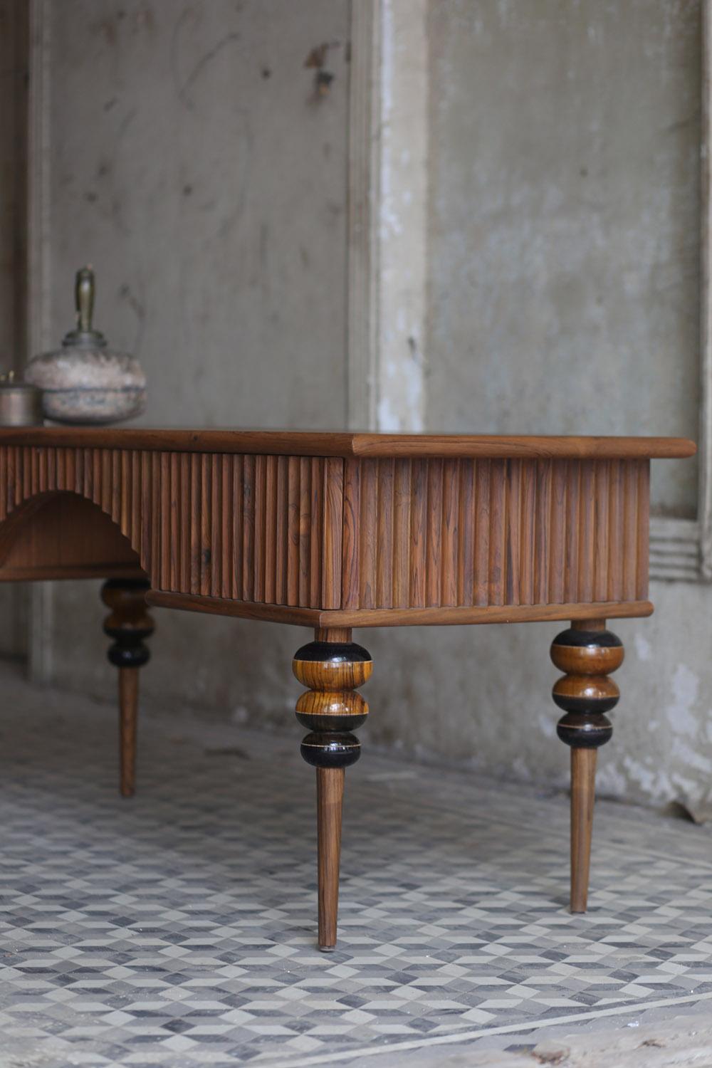 Ariane Thakore Ginwala's Droplet desk is the quintessential blend of contemporary and Classic style. Its reclaimed teak construction is handcrafted by expert artisans, ensuring every piece is created with the utmost attention to detail. The