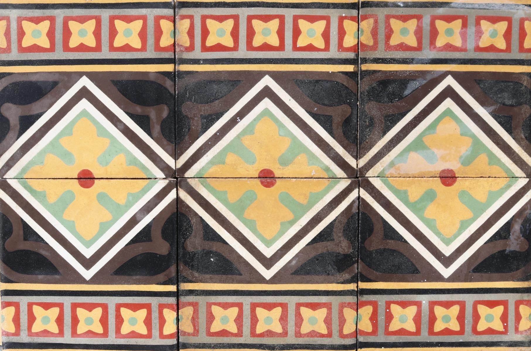 A batch of 41 reclaimed encaustic cement floor tiles. These tiles will cover 1.64 m2 or 17.6 sq. ft. They are suitable for use on floors or walls.