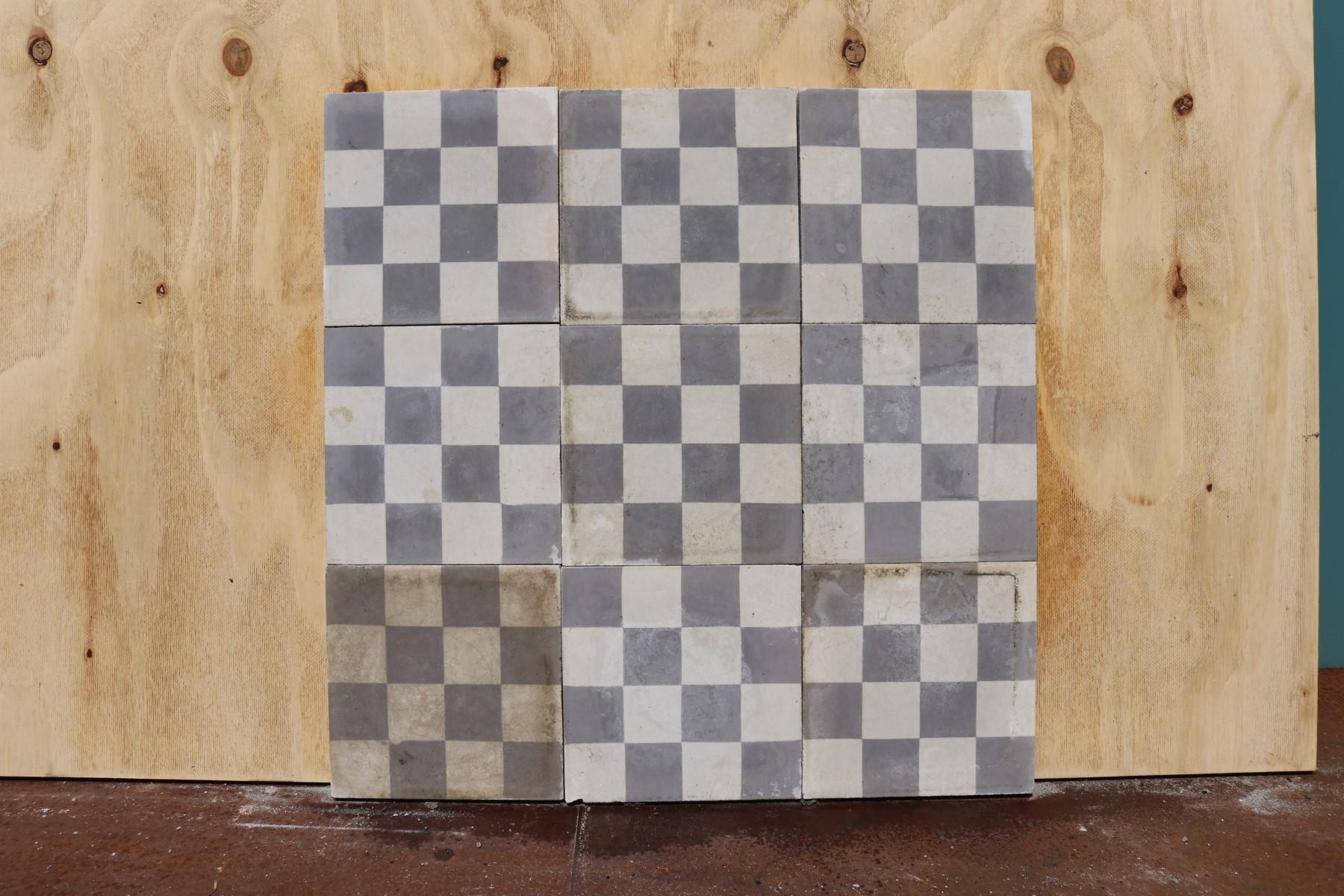 A batch of 116 reclaimed encaustic cement floor or wall tiles. Tiles are light grey and can used in a ‘checker board’ pattern. These tiles will cover 4.6 m2 or 49 ft2.

Weathered surfaces and small chips associated with transport and storage.