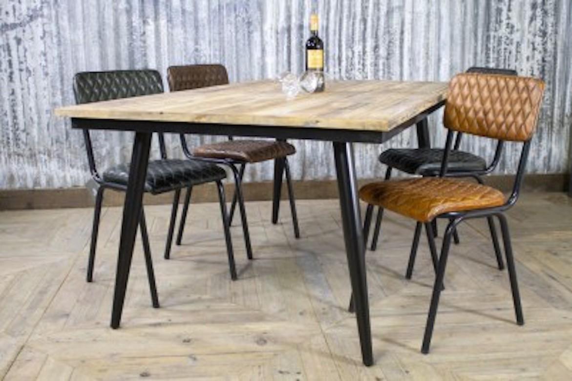 A fine reclaimed timber table with metal base, 20th century.

The perfect blend of wood and steel, this pine and steel kitchen dining table is a sleek, stylish contemporary table for your kitchen, your bar or restaurant. With a reclaimed pine top