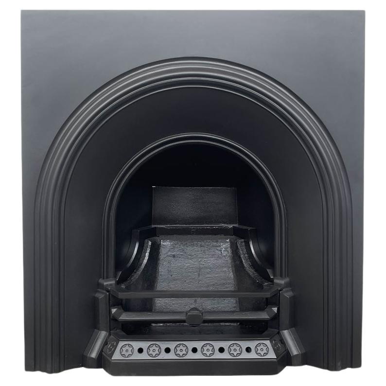 Reclaimed Victorian arched cast iron fireplace insert For Sale