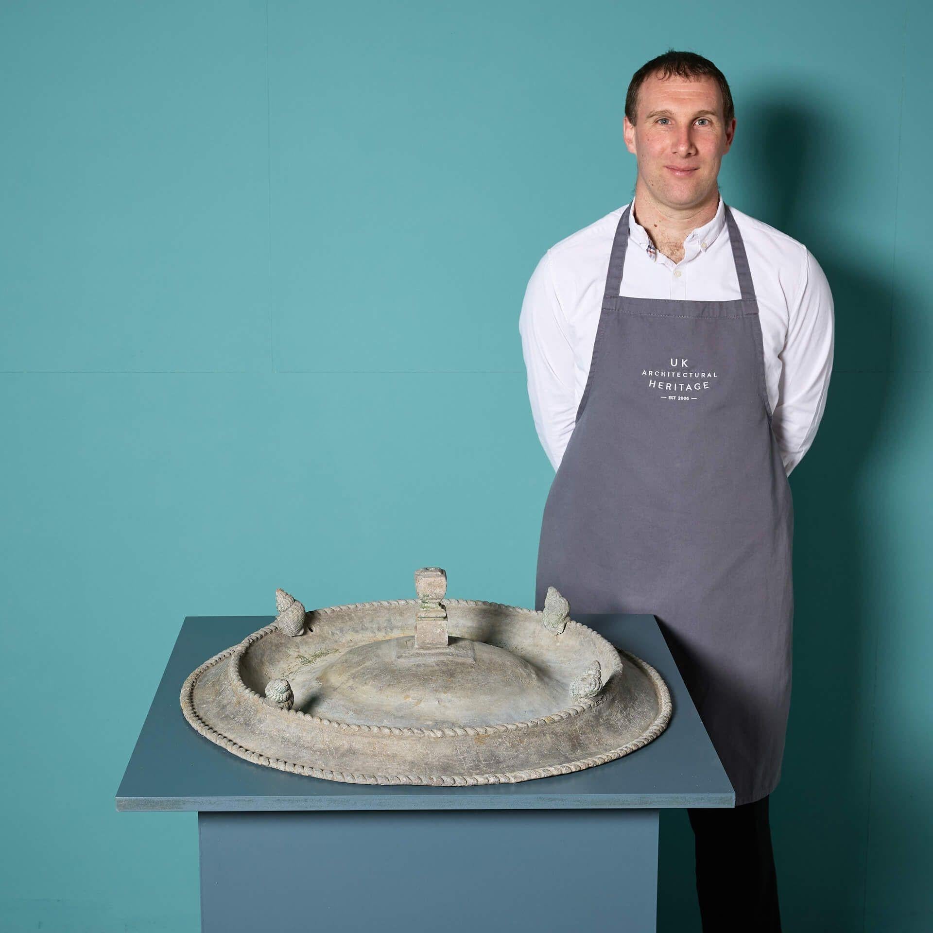 A beautiful reclaimed lead birdbath attributed to the Bromsgrove Guild of Applied Arts.
 
Incorporating Victorian and Edwardian styles and surmounted by decorative spiralling snail shells, this birdbath has a simple yet elegant design for a