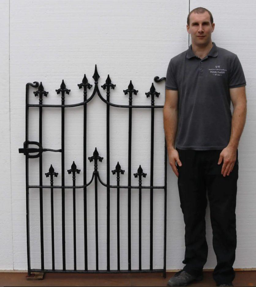 Handcrafted by a talented blacksmith of the 19th century, this Victorian wrought iron side gate is exceptionally well preserved. Original finials across the top and throughout have stood the test of time for more than 100 years, making a traditional