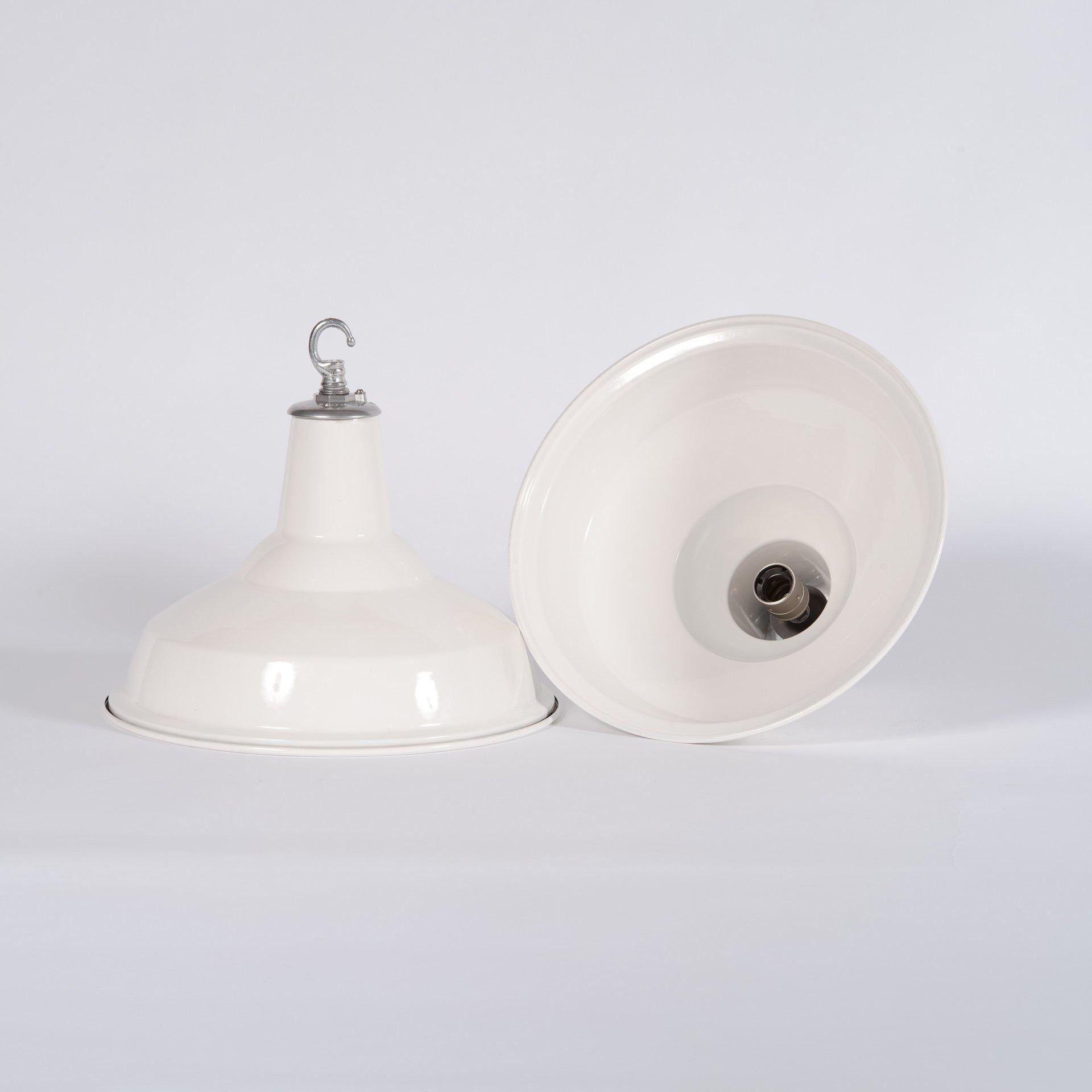 A huge run of 80 white enamel industrial pendant lights salvaged from a London Hospital plant room.

Manufactured by English firm The Benjamin Electric Limited circa 1950.

The shades are in exceptional condition in rarely seen white and in the