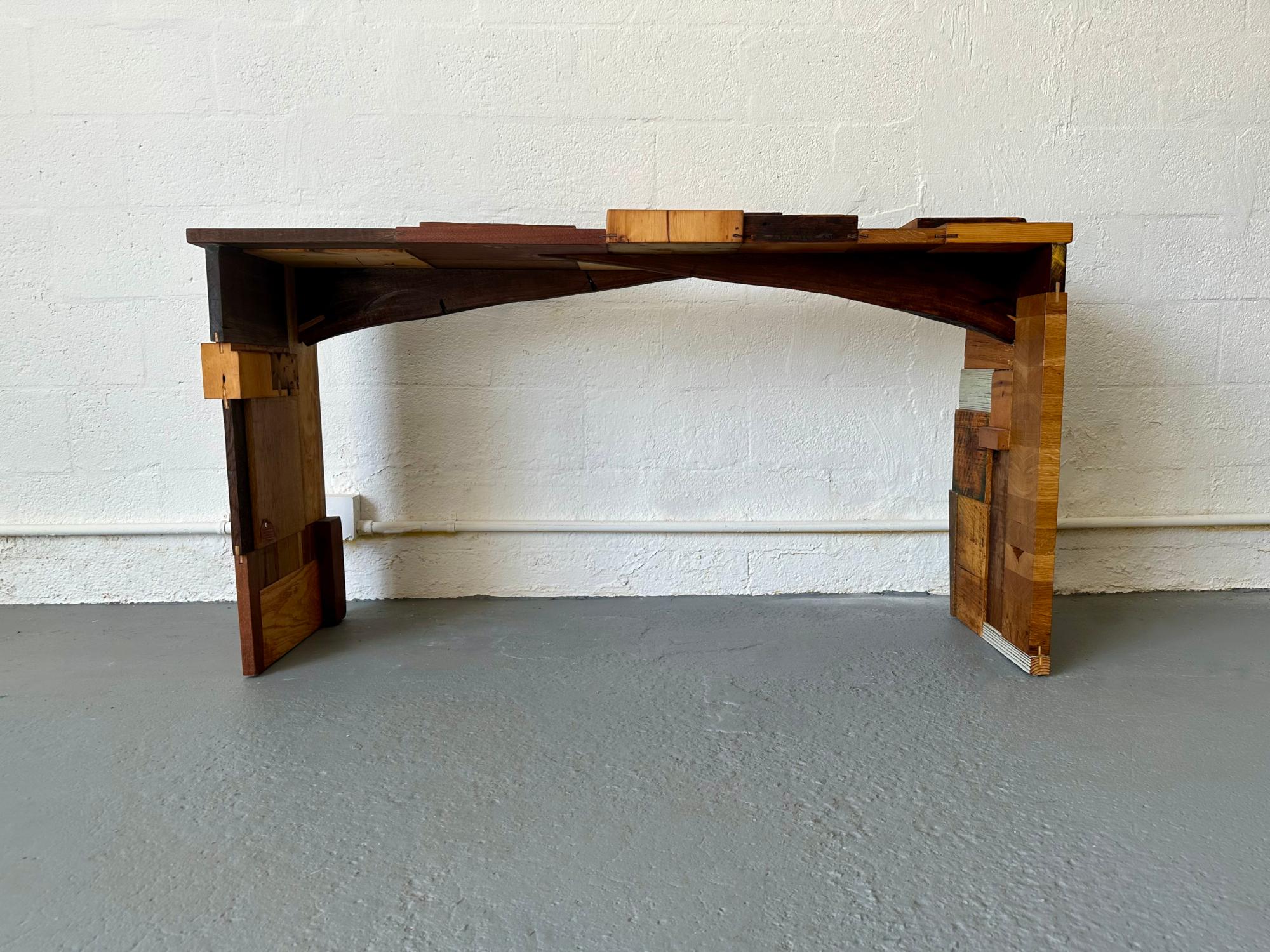 Inspired by Lego's building blocks, Rafael meticulously designed and handcrafted the Block Console Table using reclaimed hardwood pieces, transforming the remnants of woodworking into one-of-a-kind, sustainable decor. The Block Console Table is also